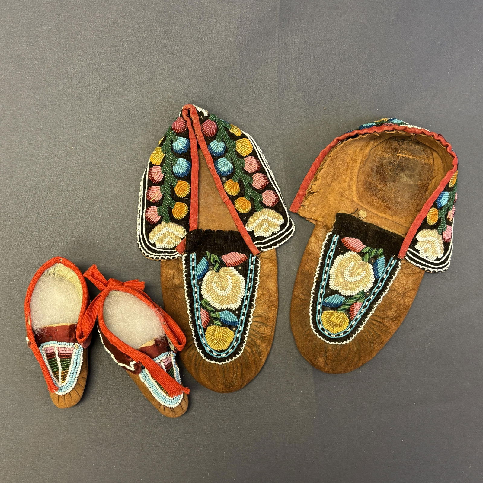 Group of 2 Leather and Fabric Beaded Moccasins Item 1: 10" long x 4 1/4" wide x 2 1/2" high, Item 2: (1 of 19)