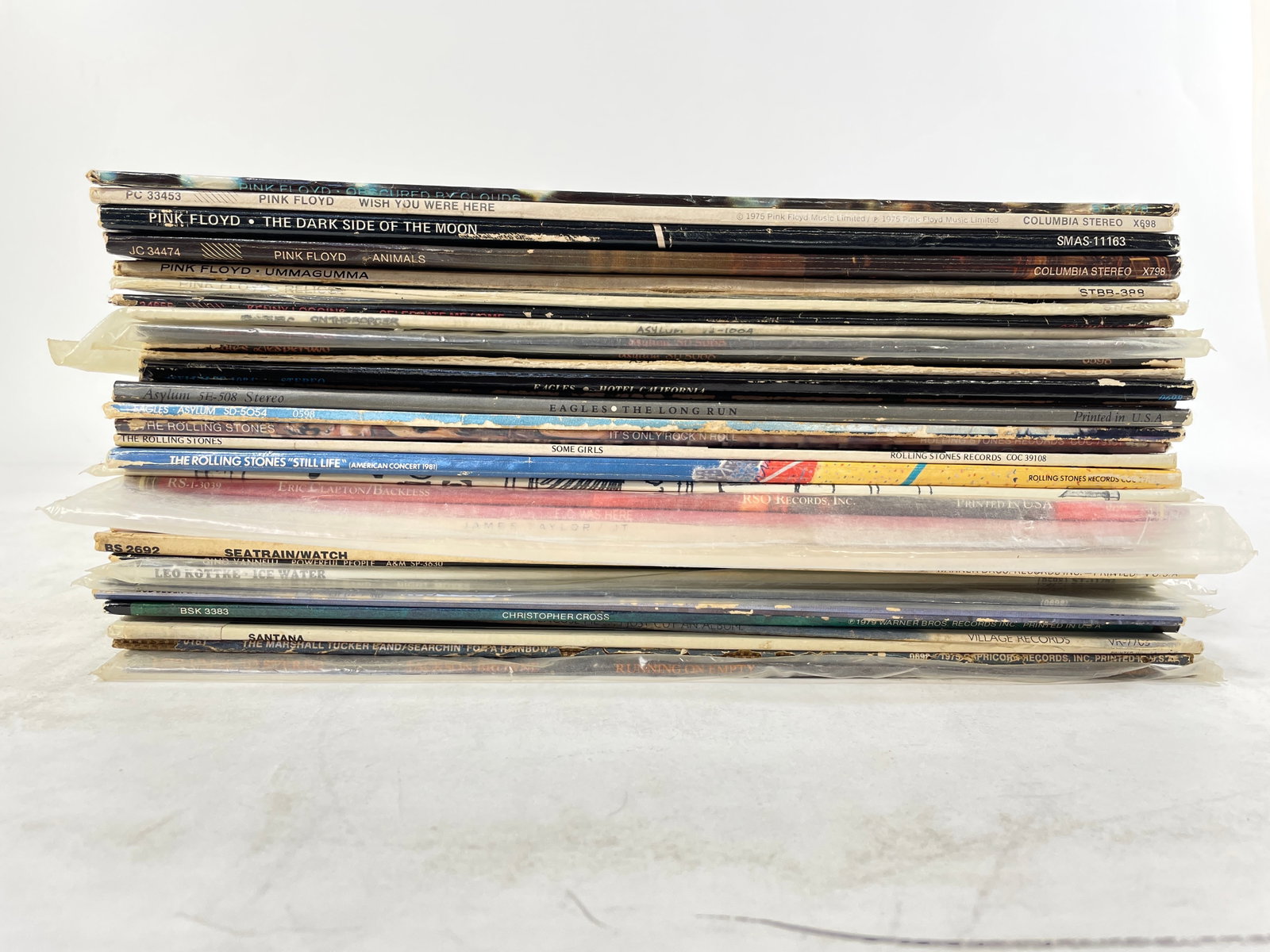 Opportunity Lot of 29 vintage vinyl records by various artists: Opportunity Lot of 29 vintage vinyl records by various artists A collection of vinyl records featuring albums from notable bands and artists such as Pink Floyd, The Rolling Stones, Eagles, and Santana