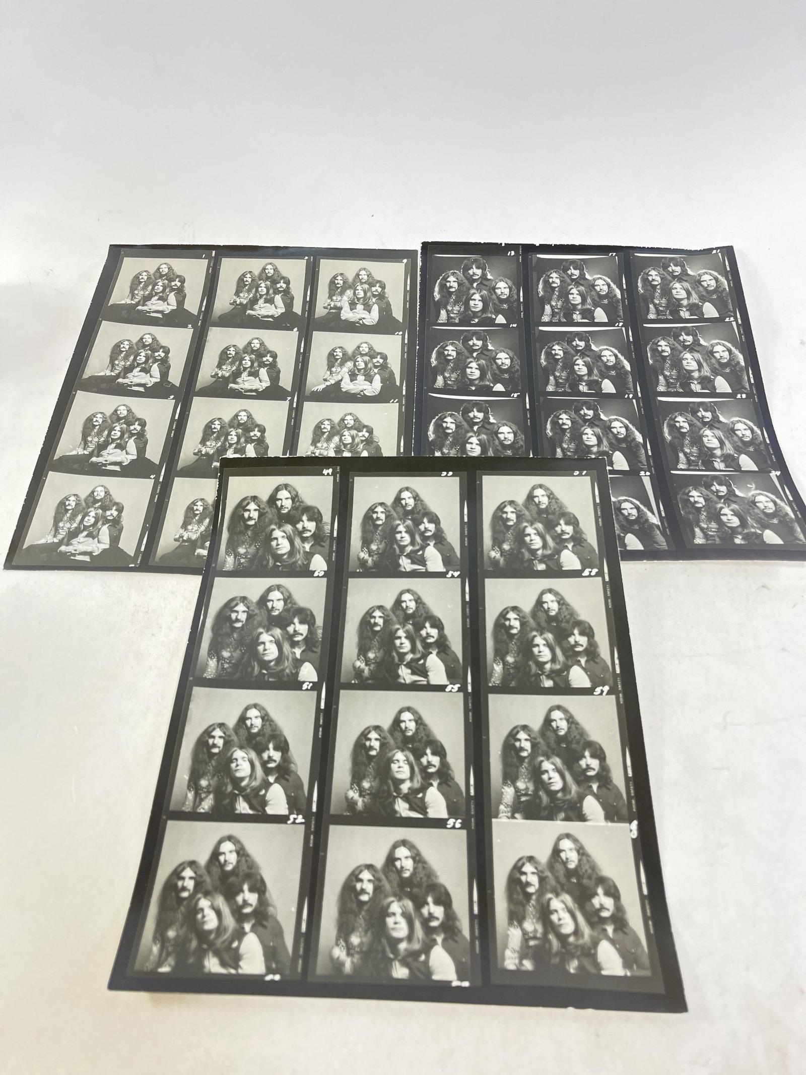 Lot of three Black Sabbath black background contact sheets of rare/unseen photos featuring Ozzy: Lot of three Black Sabbath black background contact sheets of rare/unseen photos featuring Ozzy Osbourne, Geezer Butler, Tony Iommi, Bill Ward Provenance: Connie DeNave Estate