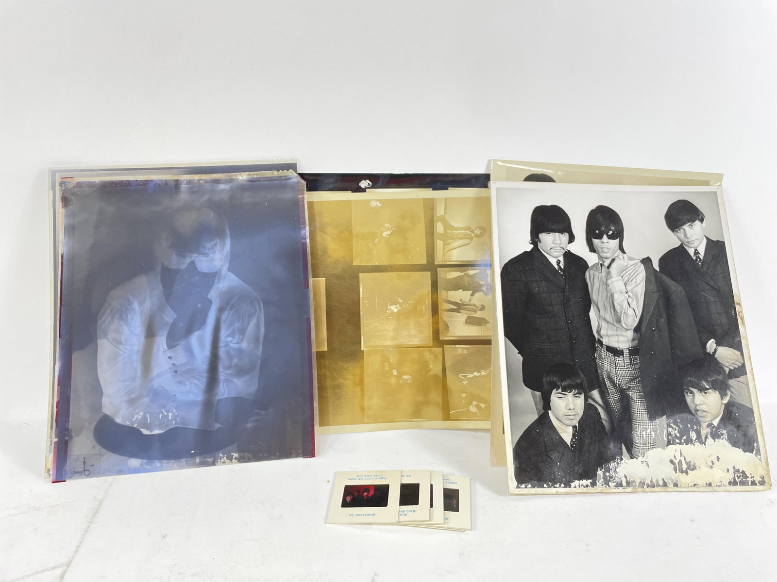 Lot of negatives, press photos, contact sheets, and colored slides of Question Mark and The: Lot of negatives, press photos, contact sheets, and colored slides of Question Mark and The Mysterians shot by Paul Jonali. Some items have significant water damage. Provenance: Connie DeNave Estate