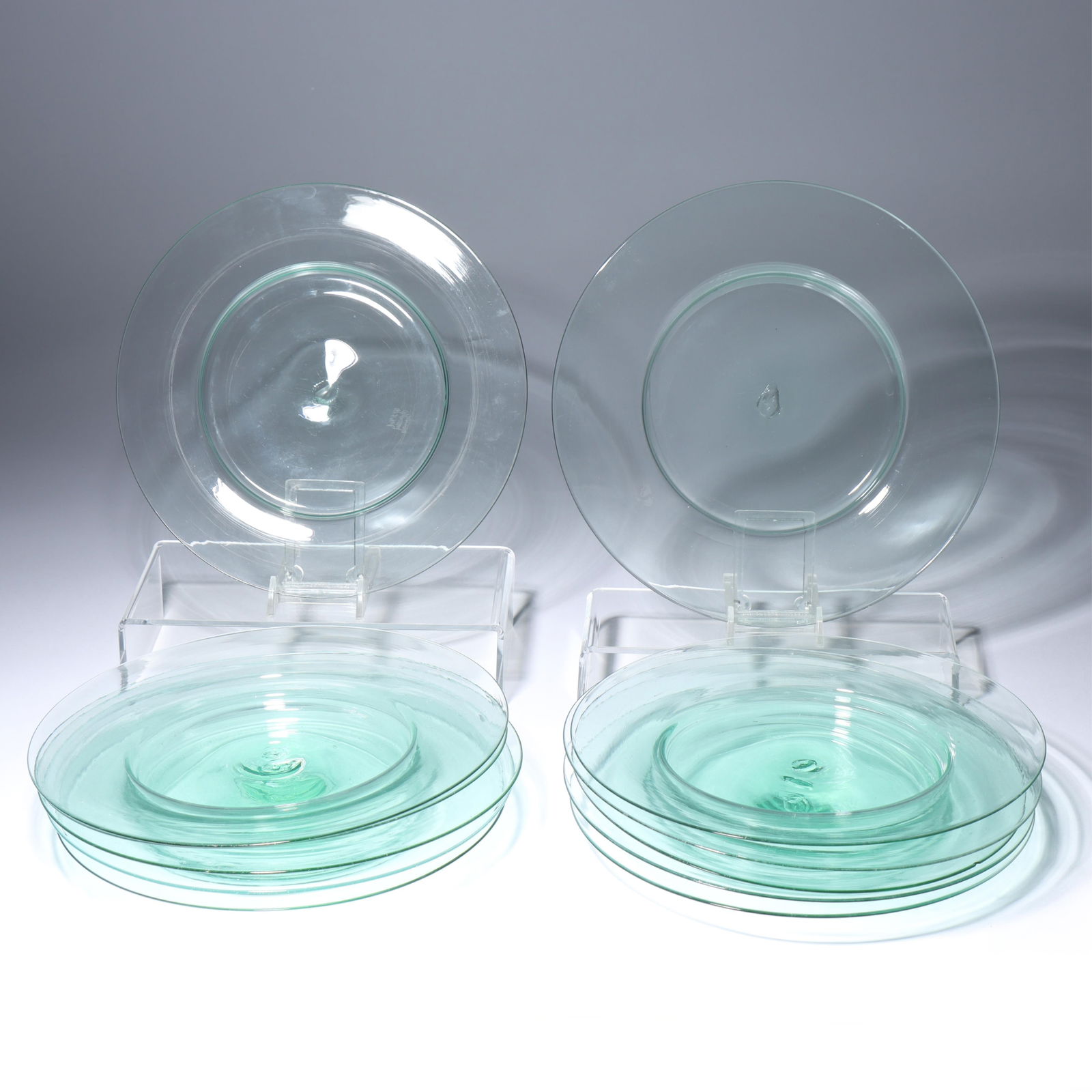 12 Maestri Vetrai Muranesi (MVM) Murano Cappellin ca. 1925 deep center dinner plates in light green: 12 Maestri Vetrai Muranesi (MVM) Murano Cappellin ca. 1925 deep center dinner plates in light green All feature acid stamp to bottom. One plate has a minor chip. Provenance: Fort Wayne Museum of Art,