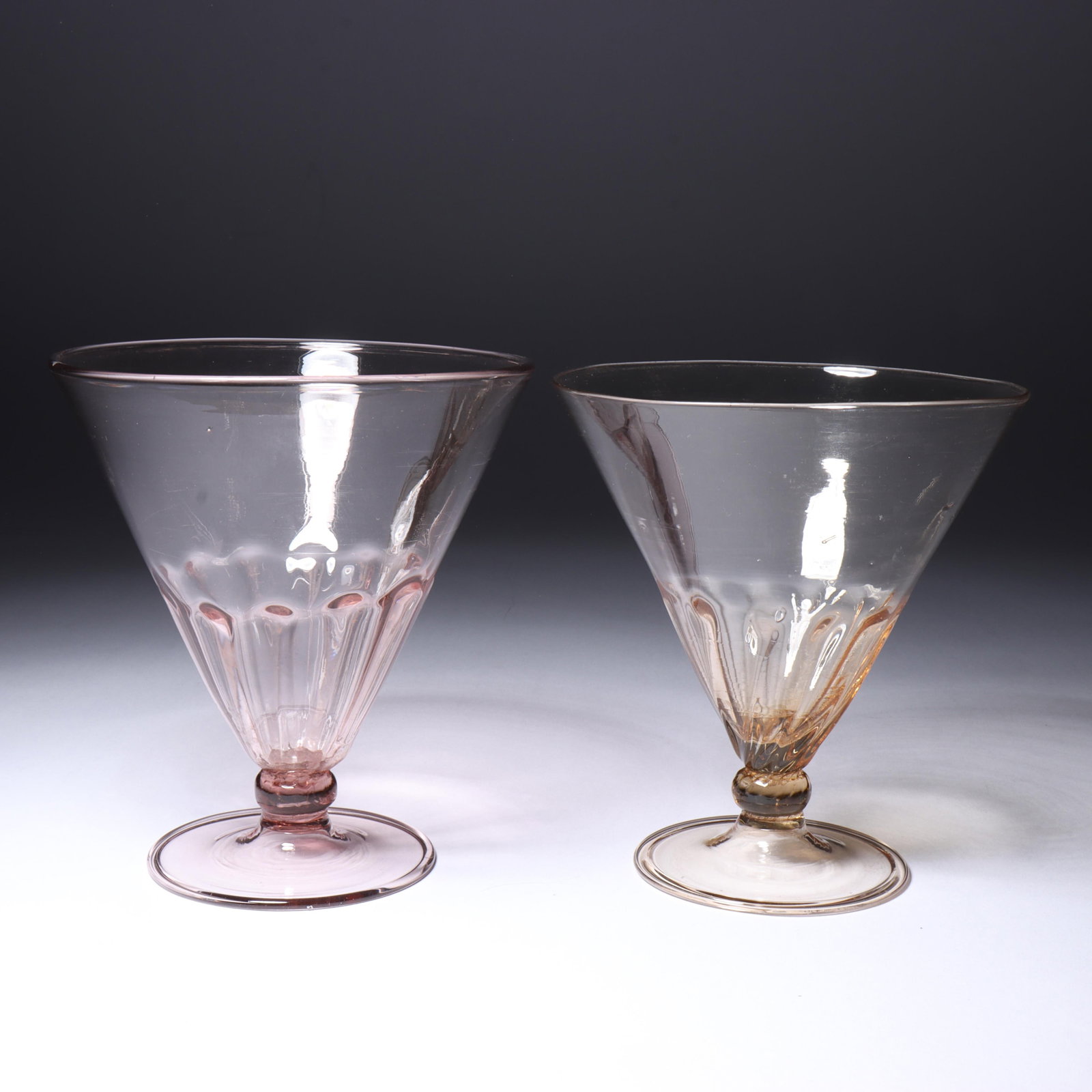 Two Maestri Vetrai Muranesi (MVM) Murano Cappellin mold blown ribbed funnel-shaped glasses in: Two Maestri Vetrai Muranesi (MVM) Murano Cappellin mold blown ribbed funnel-shaped glasses in lavender and straw No marks present. Provenance: Fort Wayne Museum of Art, Fort Wayne, Indiana. 4 1/2"H x