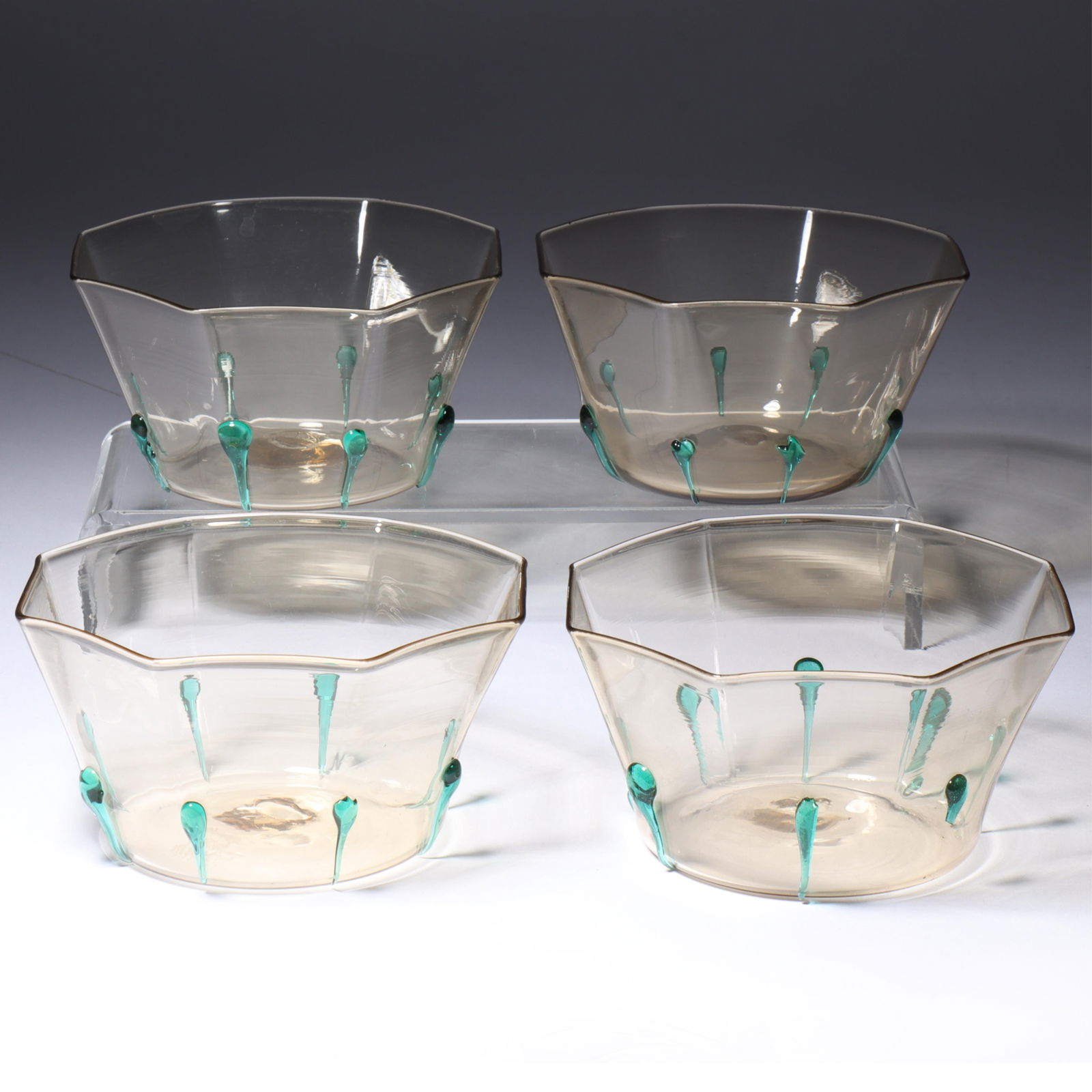 Vittorio Zecchin set of four Maestri Vetrai Muranesi (MVM) Murano Cappellin 8-sided bowls in straw: Vittorio Zecchin set of four Maestri Vetrai Muranesi (MVM) Murano Cappellin 8-sided bowls in straw with applied green drips Acid stamps on bottoms. Provenance: Fort Wayne Museum of Art, Fort Wayne, In