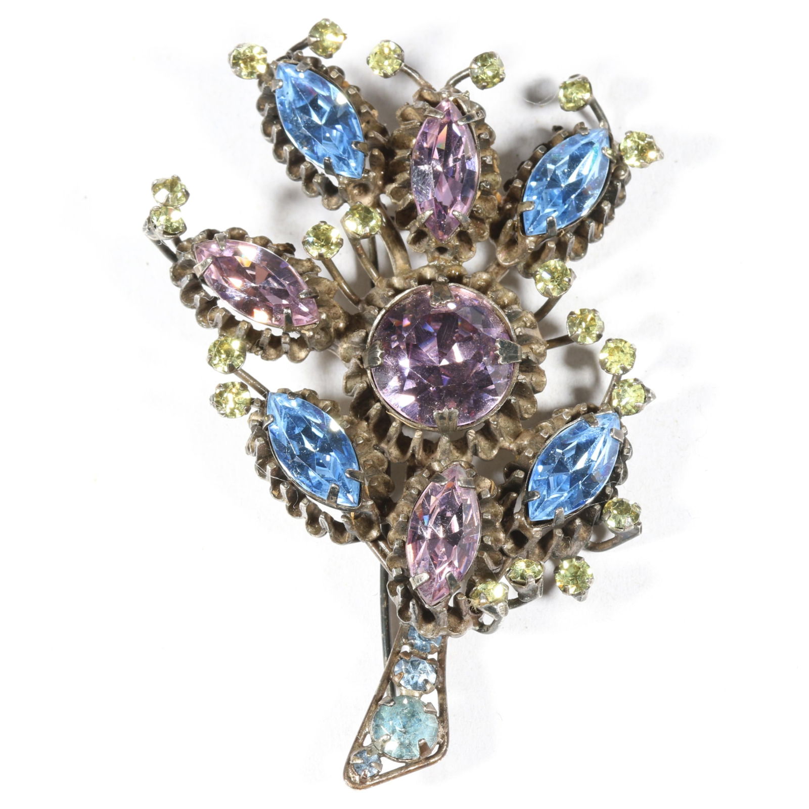 Hattie Carnegie dimensional jeweled floral brooch. 3 1/8"H x 2 1/8"W: Hattie Carnegie dimensional jeweled floral brooch. From the inventory of the former vintage costume jewelry business, "Aunt Tink", "seller of the collectible, the fun and the unique", owned by Gail Cr