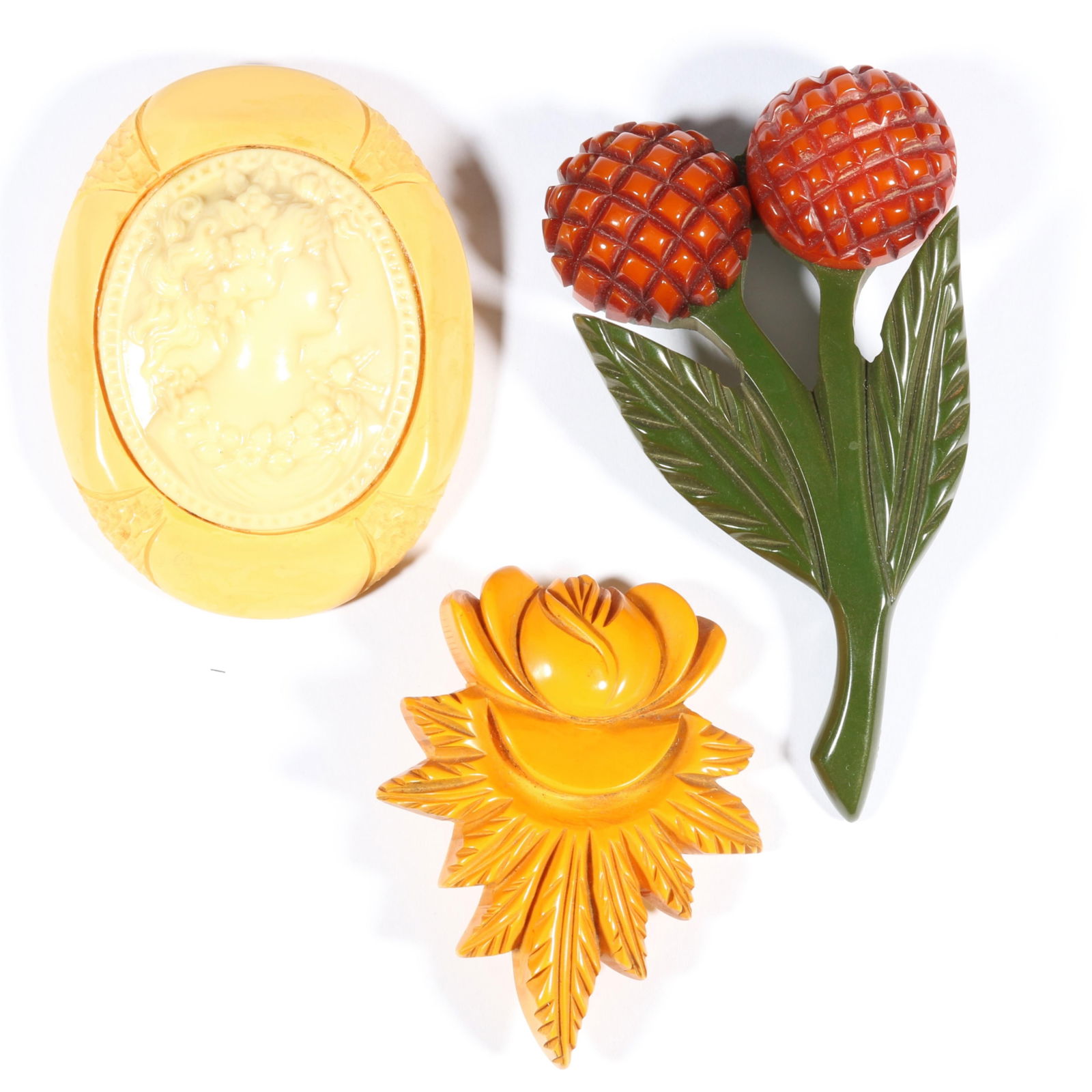 Vintage Bakelite brooch group including cameo brooch, and pair of floral brooches. 3 1/2"H x 1 7/8"W (1 of 14)