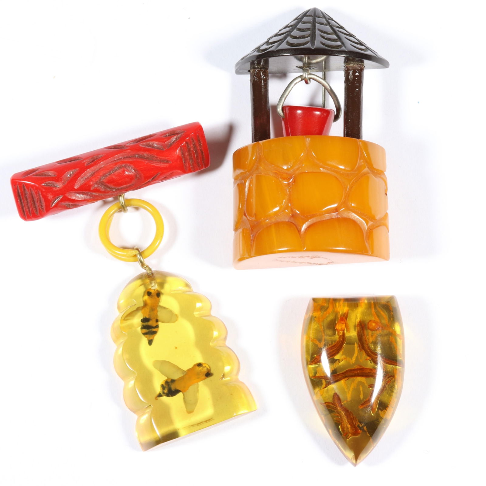 Vintage Bakelite brooch group including wishing well brooch with bucket charm, reverse carved and (1 of 14)