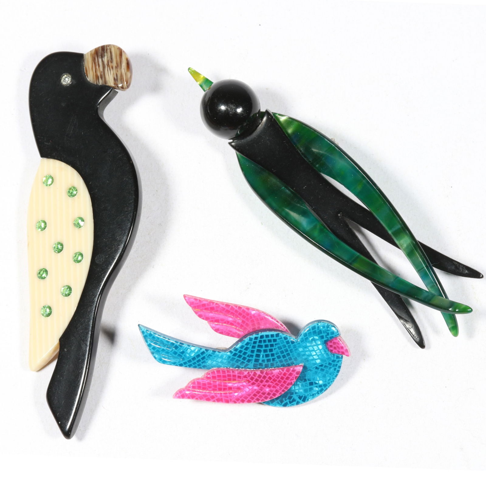 Lea Stein 3pc. cellulose acetate bird brooches Parrot, Dove, and Swallow. 3 3/8"H x 1 1/4"W: Lea Stein 3pc. cellulose acetate bird brooches Parrot, Dove, and Swallow. From the inventory of the former vintage costume jewelry business, "Aunt Tink", "seller of the collectible, the fun and the un