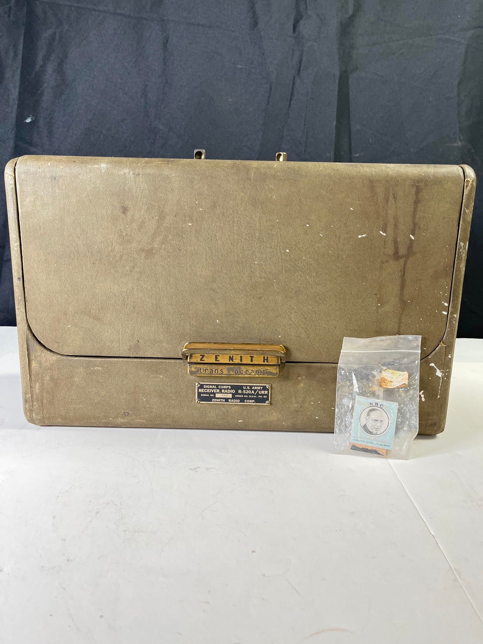 Zenith Trans-Oceanic radio, U.S. Army model R-520A/URR, 1956, untested. ALSO, vintage matches with: Zenith Trans-Oceanic radio, U.S. Army model R-520A/URR, 1956, untested. ALSO, vintage matches with Alios Havrilla on the cover & short bio on the back.