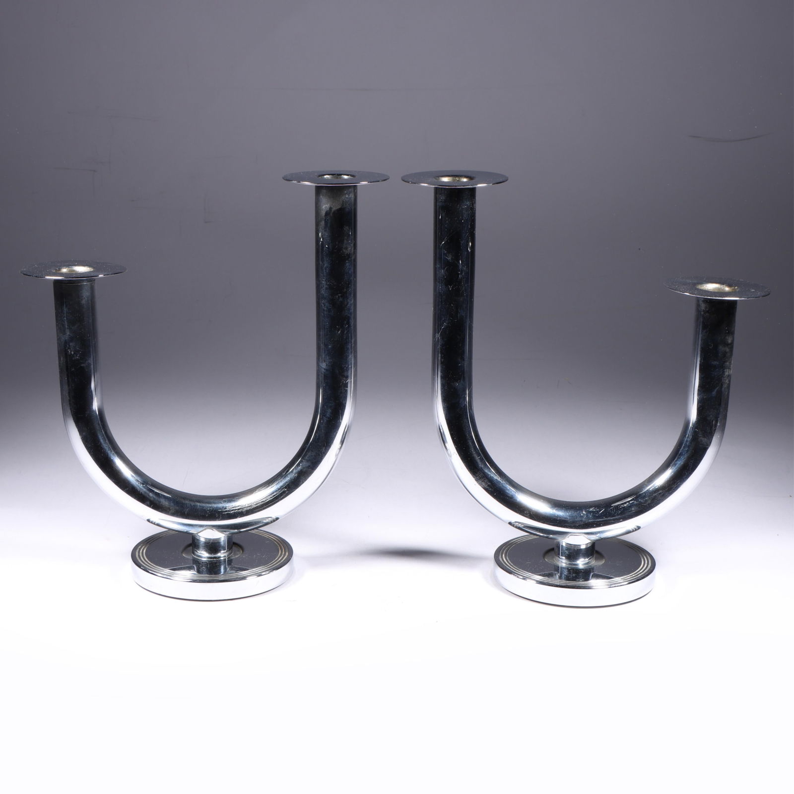 Art Deco Chase Chrome Taurex Candlesticks 10"H x 8 3/4"W (one): Art Deco Chase Chrome Taurex Candlesticks No. 24004. Quote from catalog - A reasonably priced candlestick designed to hold two candles in the smart uneven arrangement. For a suggestion, display it in