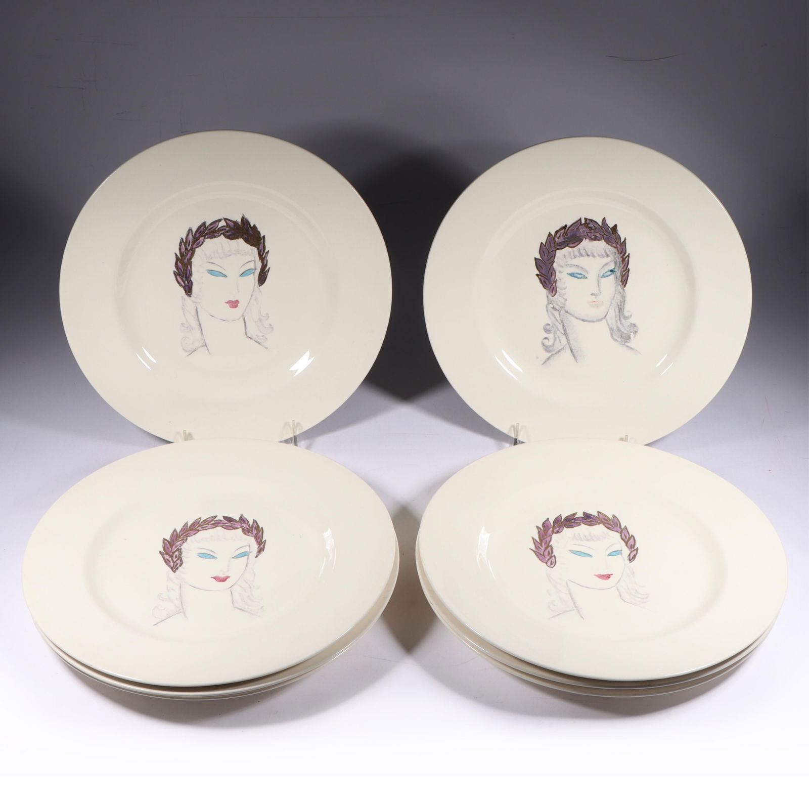 Eight Art Deco Hand Painted Dinner Plates 11"Diam. (one): Eight Art Deco Hand Painted Dinner Plates An iridescent gold highlights the blue, purple, red, and grey colors of these individually hand painted service plates. Probably German blanks, the manufactur