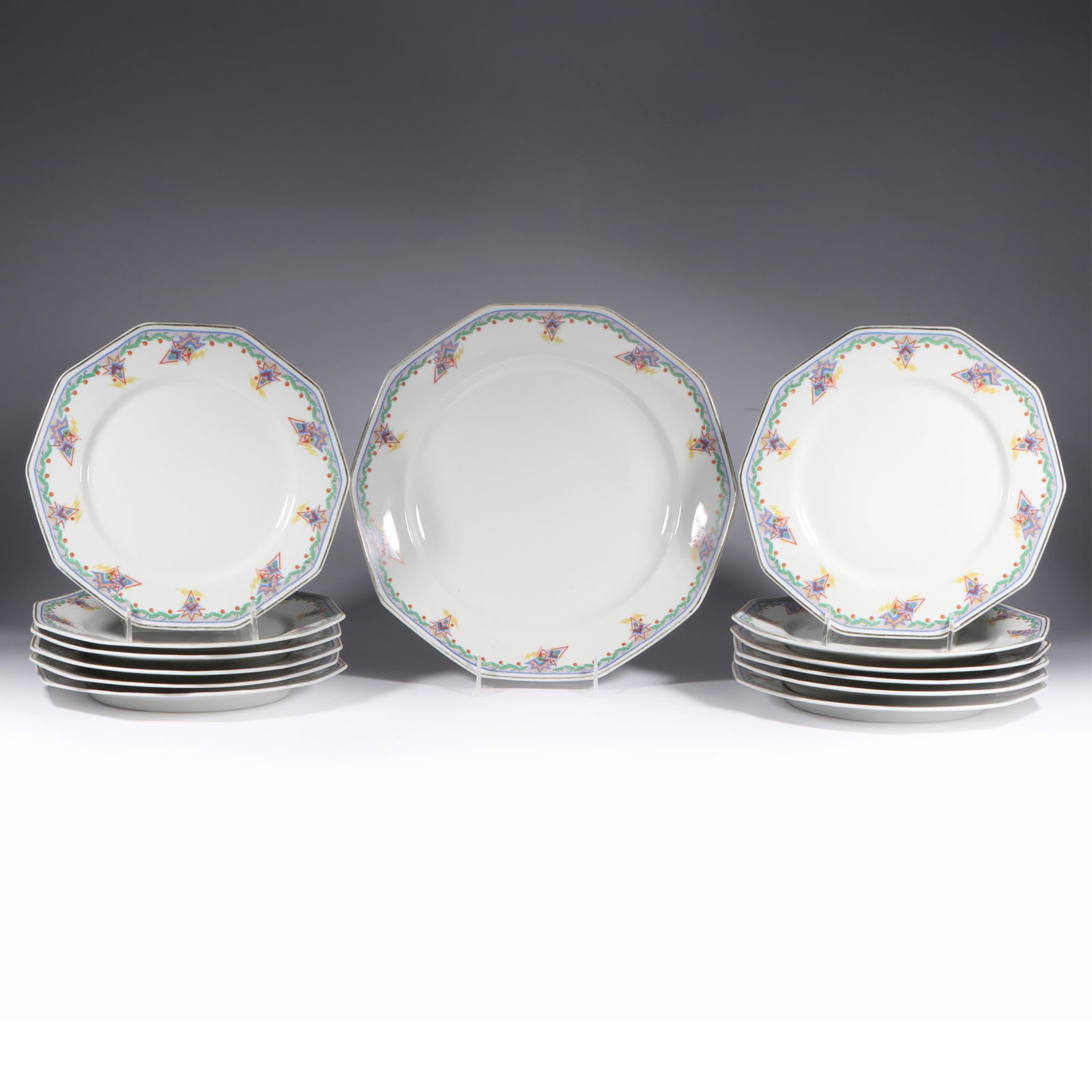 Art Deco Limoges 13 Piece Cake Set 12"Diam. (chop plate): Art Deco Limoges 13 Piece Cake Set Twelve dinner plates and a chop or cake plate marked "Limoges, France, Depose." Marked on reverse: monogram for Charles Martel & Duche. Provenance: Charles Alexander