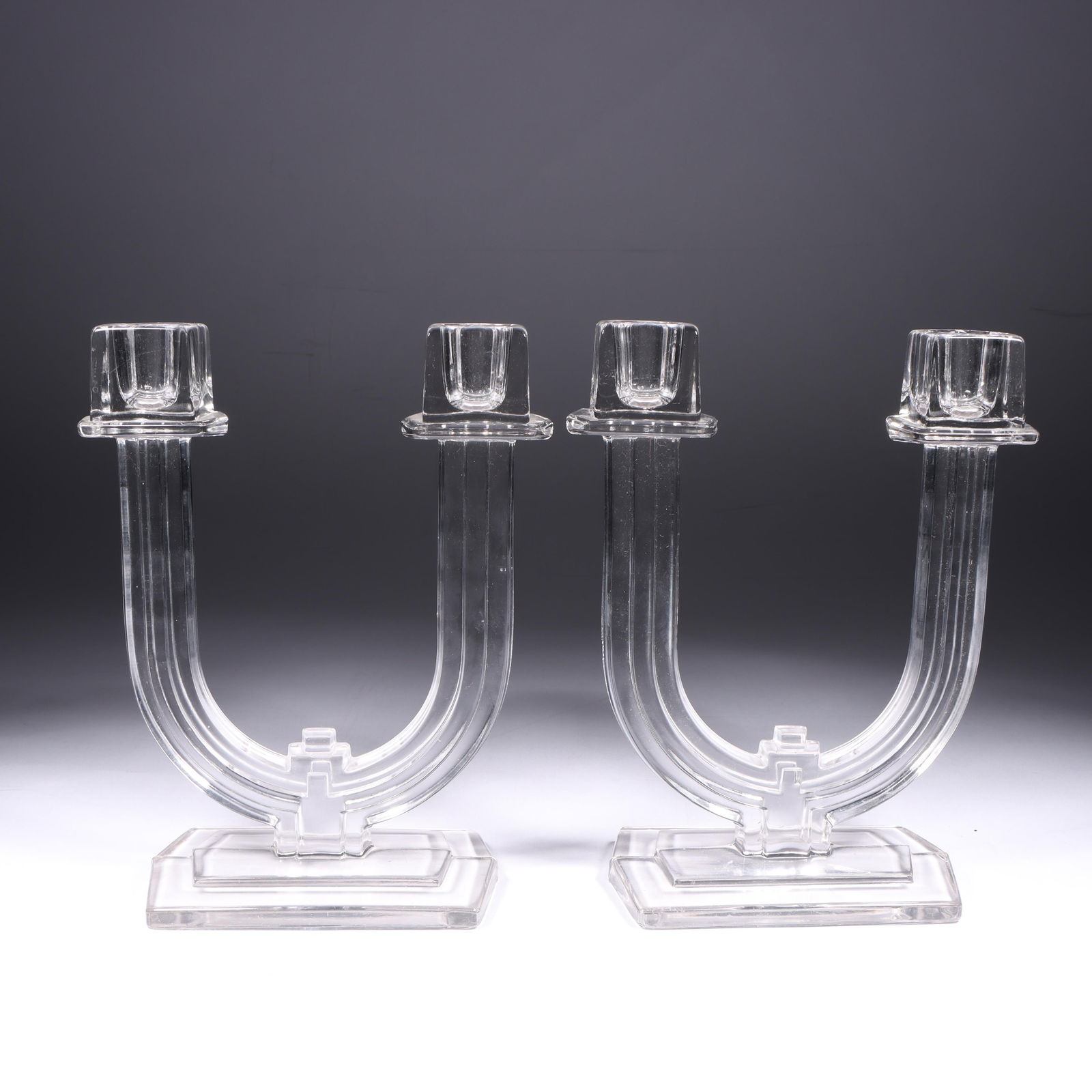 Pair of Heisey New Era Candlesticks 8"H x 6 1/4"W (one): Pair of Heisey New Era Candlesticks Two double light Candlesticks. Provenance Charles Alexander, Indianapolis, IN 8"H x 6 1/4"W (one)