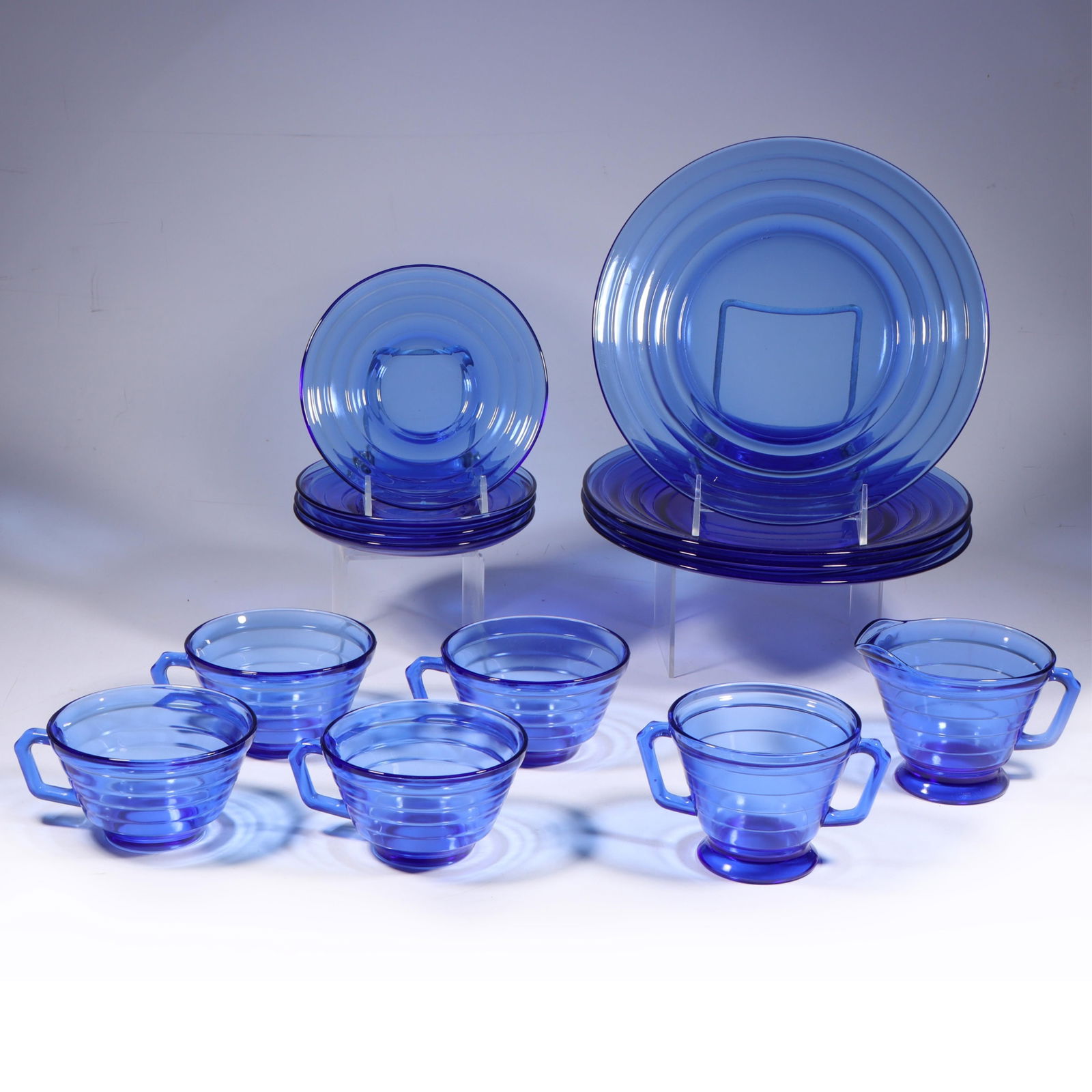 Art Deco Moderntone Cobalt Blue Glass 14 Pc. Service 9"Diam. (largest plates): Art Deco Moderntone Cobalt Blue Glass 14 Pc. Service Hazel Atlas 1936 Moderntone Service for four; 4 cups, 4 saucers, 4 plates, creamer, & sugar bowl. Provenance Charles Alexander, Indianapolis, IN 9"