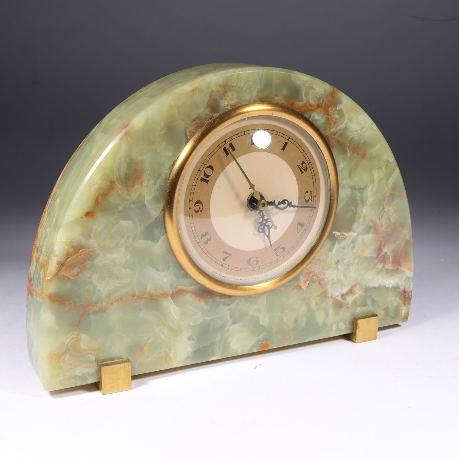 Art Deco 1930 Hammond Onyx & Brass Clock 6 1/4"H x 8"W: Art Deco 1930 Hammond Onyx & Brass Clock A simple half-circle of green Onyx highlighted by a brass face and simple cube feet make this a perfect example of Art Deco restraint. Patent dates of 1930-31.