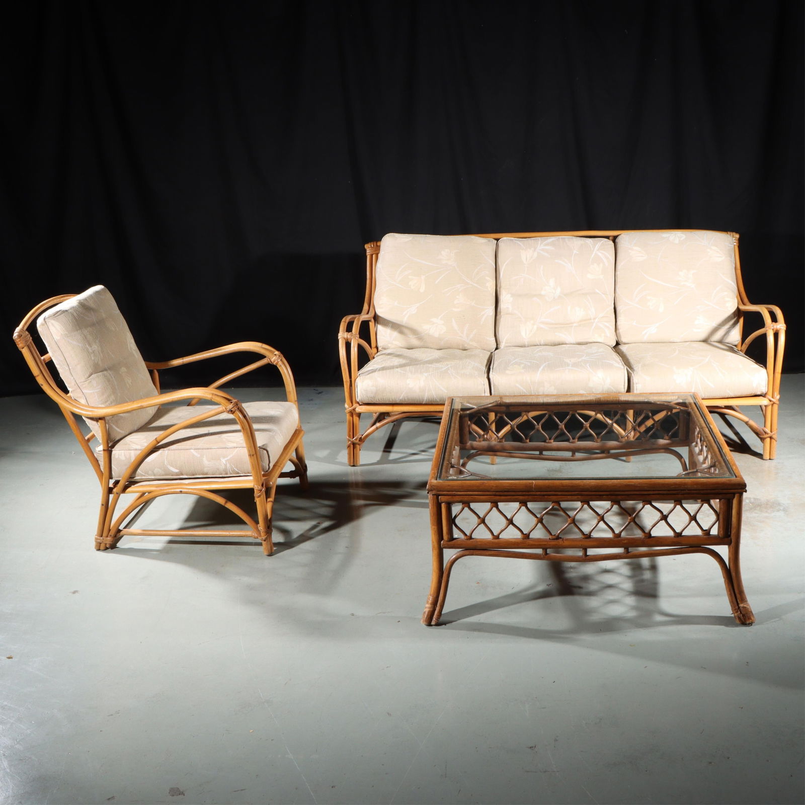 Heywood-Wakefield 3pc. rattan patio set with one sofa, one chair, and one glass-top table 31"H x: Heywood-Wakefield 3pc. rattan patio set with one sofa, one chair, and one glass-top table 31"H x 70"W (couch)