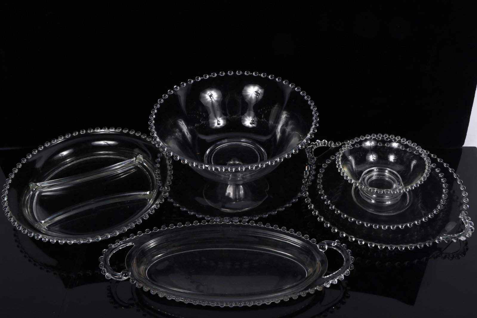 Collection of Imperial Glass Candlewick Clear servewares, 7pc.: handled pickle dish, low cake stand,: Collection of Imperial Glass Candlewick Clear servewares, 7pc.: handled pickle dish, low cake stand, divided serving tray, large serving bowl, handled serving tray, saucer and bowl 3 1/2"H x 10"Diam. 