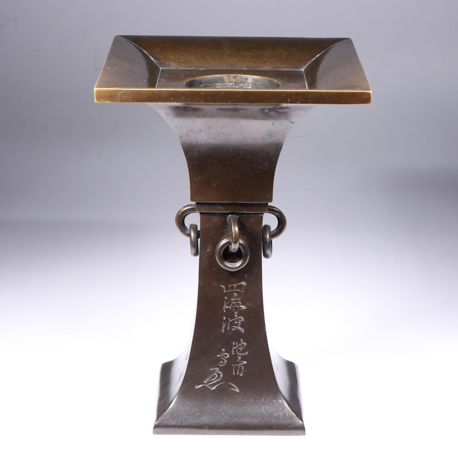 Japanese bronze Shikainami Ikenobo Ikebana vase 10 3/4"H x 7 1/4"W x 7 1/4"D: Japanese bronze Shikainami Ikenobo Ikebana vase This vase, titled "Shikainami" or "Waves of the Four Seas" was favored by Ikenobo Senkei, a headmaster of the Ikenobo Ikebana school. The vase features