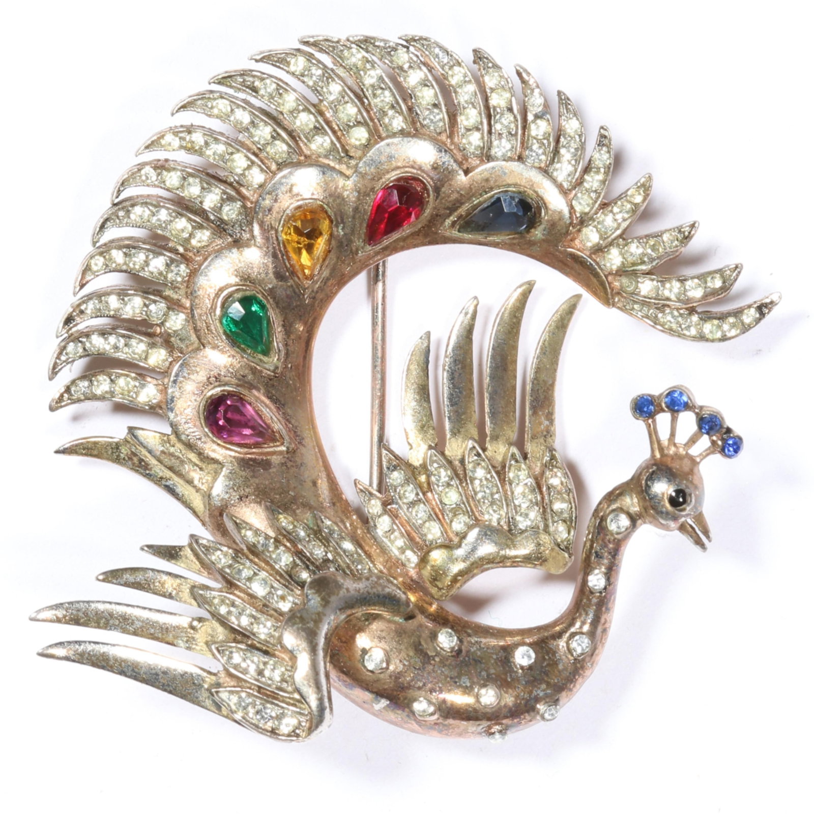Rare Trifari Alfred Philippe 1942 sterling vermeil "Flying Peacock" book piece fur clip with multi: Rare Trifari Alfred Philippe 1942 sterling vermeil "Flying Peacock" book piece fur clip with multi color pear shaped stones and pave rhinestone feathers American Costume Jewelry Vol. 2 by Carla Ginell