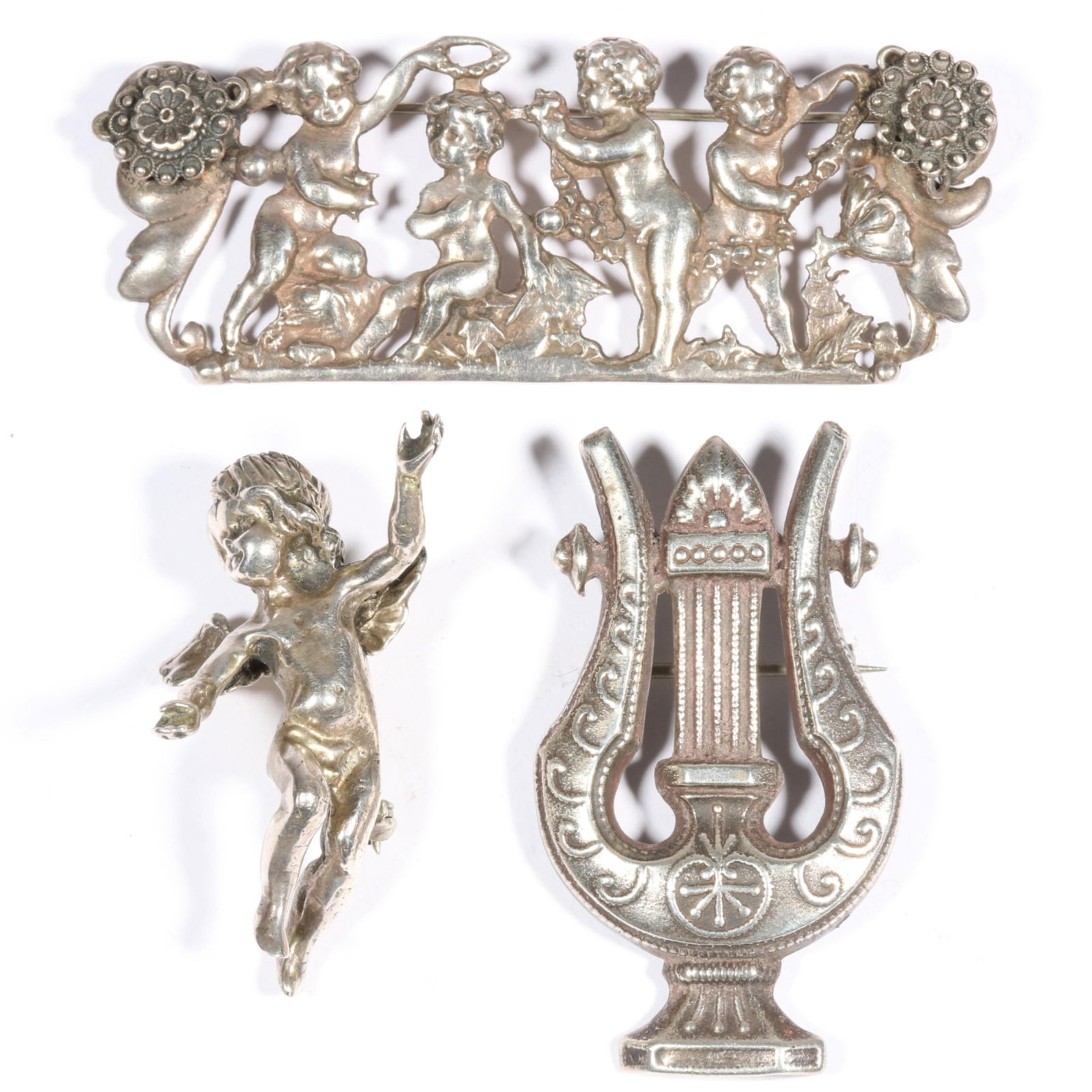 Peruzzi sterling silver cherubs and harp brooch with unmarked sterling cherub in the round brooch. 1: Peruzzi sterling silver cherubs and harp brooch with unmarked sterling cherub in the round brooch. From the life time collection of Donna Soodalter-Toman, DIVA owner/founder and winner of Best of Bost