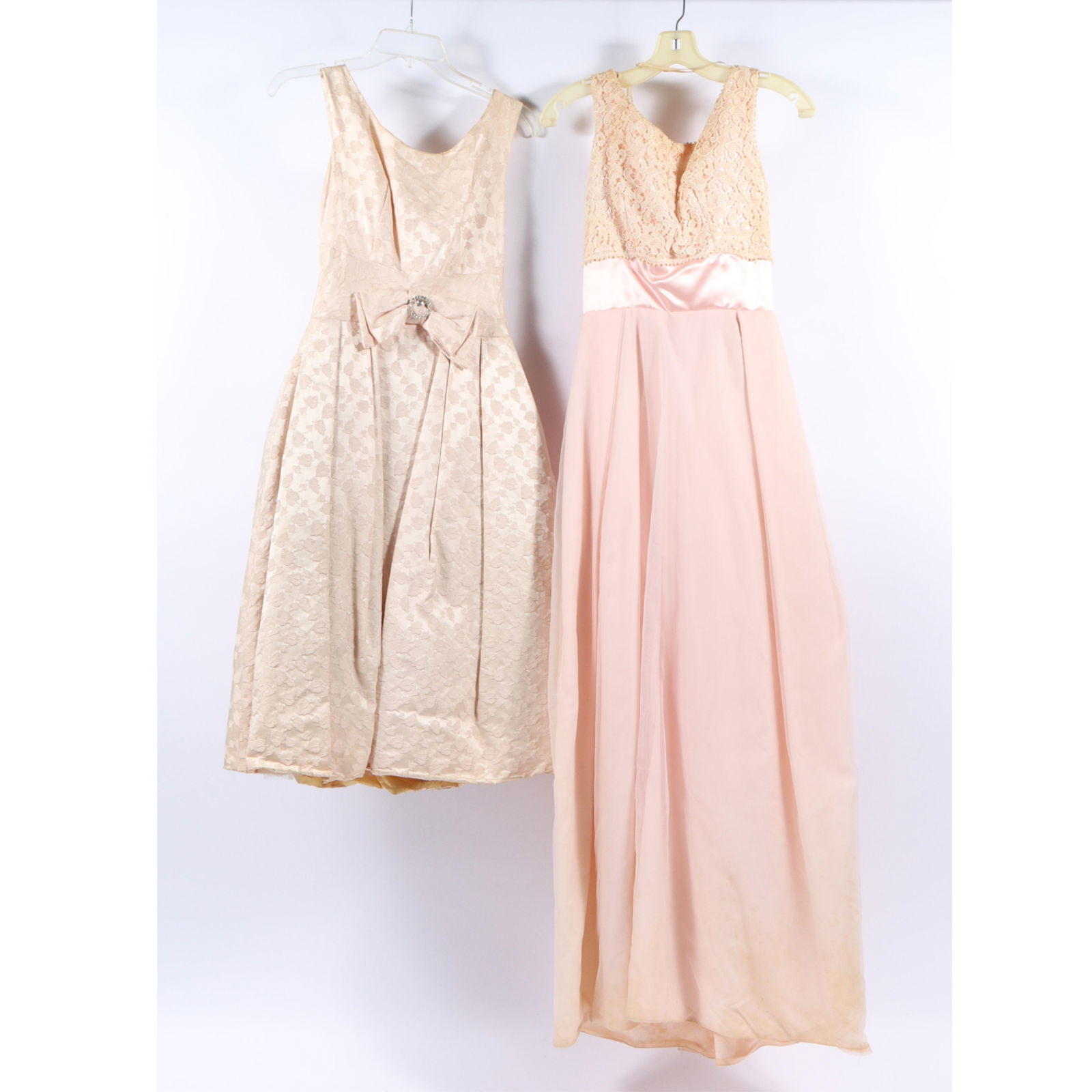 Vintage 1950s/60s unbranded cocktail dress and gown 2pc group with International Ladies' Garment: Vintage 1950s/60s unbranded cocktail dress and gown 2pc group with International Ladies' Garment Workers' Union (ILGWU) tags Two vintage dresses, likely from the 1950s or 1960s, featuring lace bodices