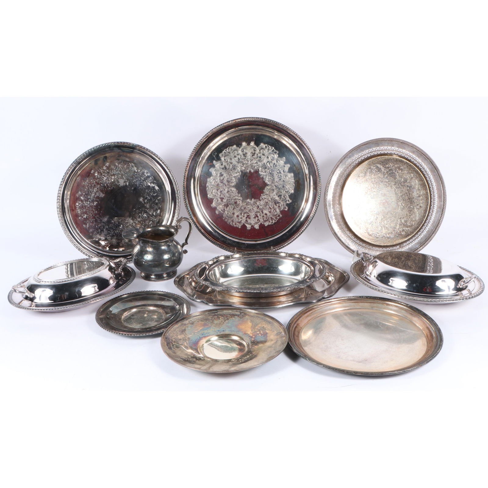 Collection of silverplate serveware, 11pc: servings trays, covered dishes, creamer 1"H x 14" Diam.: Collection of silverplate serveware, 11pc: servings trays, covered dishes, creamer 1"H x 14" Diam. (Largest Plate)