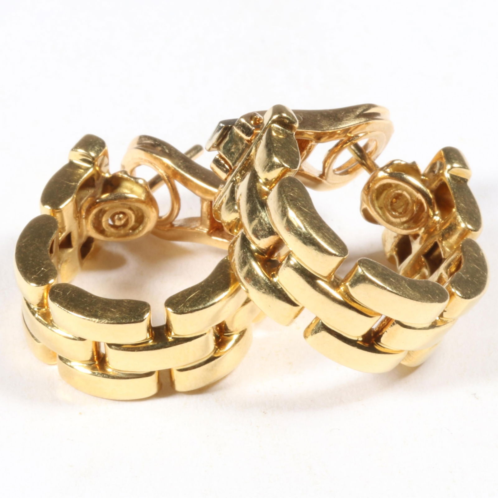 Cartier 18K yellow gold Maillon Panthere three row link huggie hoop post earrings, 1992. 5/8"H x: Cartier 18K yellow gold Maillon Panthere three row link huggie hoop post earrings, 1992. 10.038DWT total Serial # E61372 The purchase of gold requires confirmed funds. From the collection of G. Thrapp