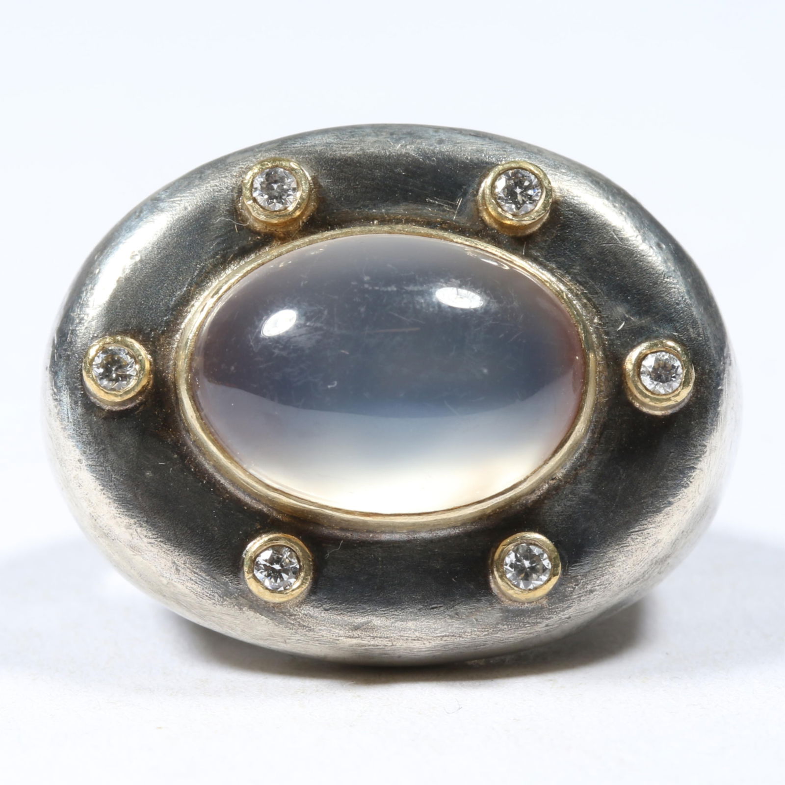 Lika Behar 24K yellow gold and solid sterling silver moonstone center ring surrounded by 6 brilliant: Lika Behar 24K yellow gold and solid sterling silver moonstone center ring surrounded by 6 brilliant cut diamonds. 8.47DWT From the collection of G. Thrapp Jewelers Ring size 6 1/4