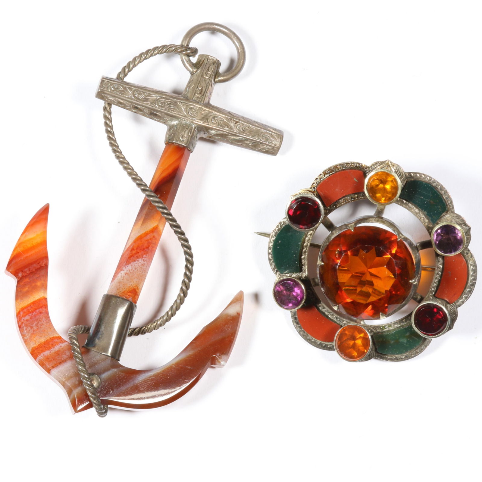 Antique Scottish agate unmarked sterling? anchor brooch with unmarked sterling? agate and large: Antique Scottish agate unmarked sterling? anchor brooch with unmarked sterling? agate and large glass stone center brooch. Both have loose rivets. Provenance: From the collection of Sue Rudman, owner