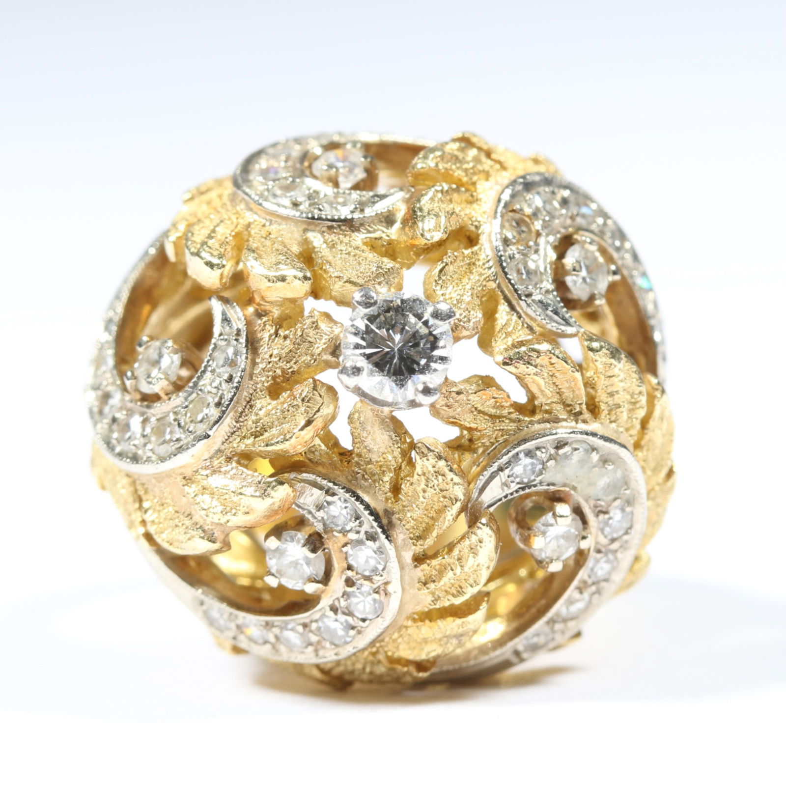 18K yellow gold and platinum retro openwork domed ring with 41 round brilliant and single cut: 18K yellow gold and platinum retro openwork domed ring with 41 round brilliant and single cut diamonds 13.766DWT Approx. .75 total cttw G-H, SI1-SI2 Small chip on center diamond The purchase of gold r