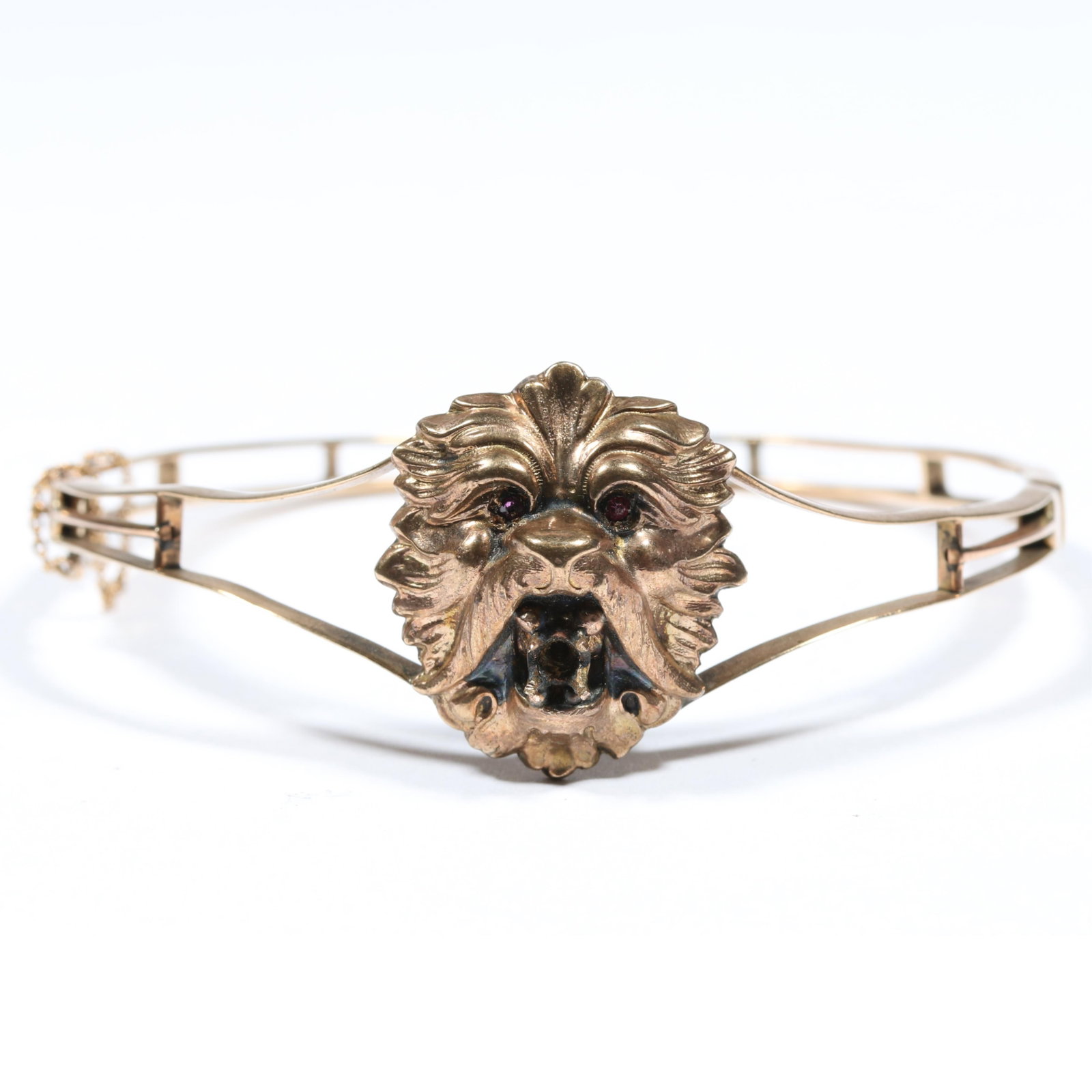 Victorian low karat gold 9K or 10K lion / mythical creature bracelet with ruby eyes, unmarked: Victorian low karat gold 9K or 10K lion / mythical creature bracelet with ruby eyes, unmarked tested. Missing large gemstone in mouth. 10.60DWT The purchase of gold requires confirmed funds. 1"H x 2 3