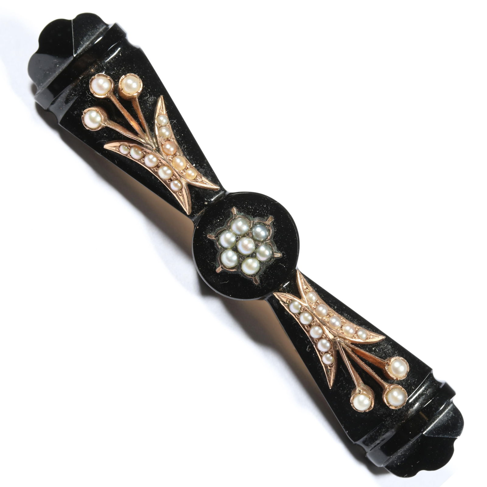 14K gold antique Victorian carved onyx bar brooch with seed pearl accents. 2 3/8"L x 1/2"W: 14K gold antique Victorian carved onyx bar brooch with seed pearl accents. Back has some glue repair. 5.80DWT The purchase of gold requires confirmed funds. 2 3/8"L x 1/2"W