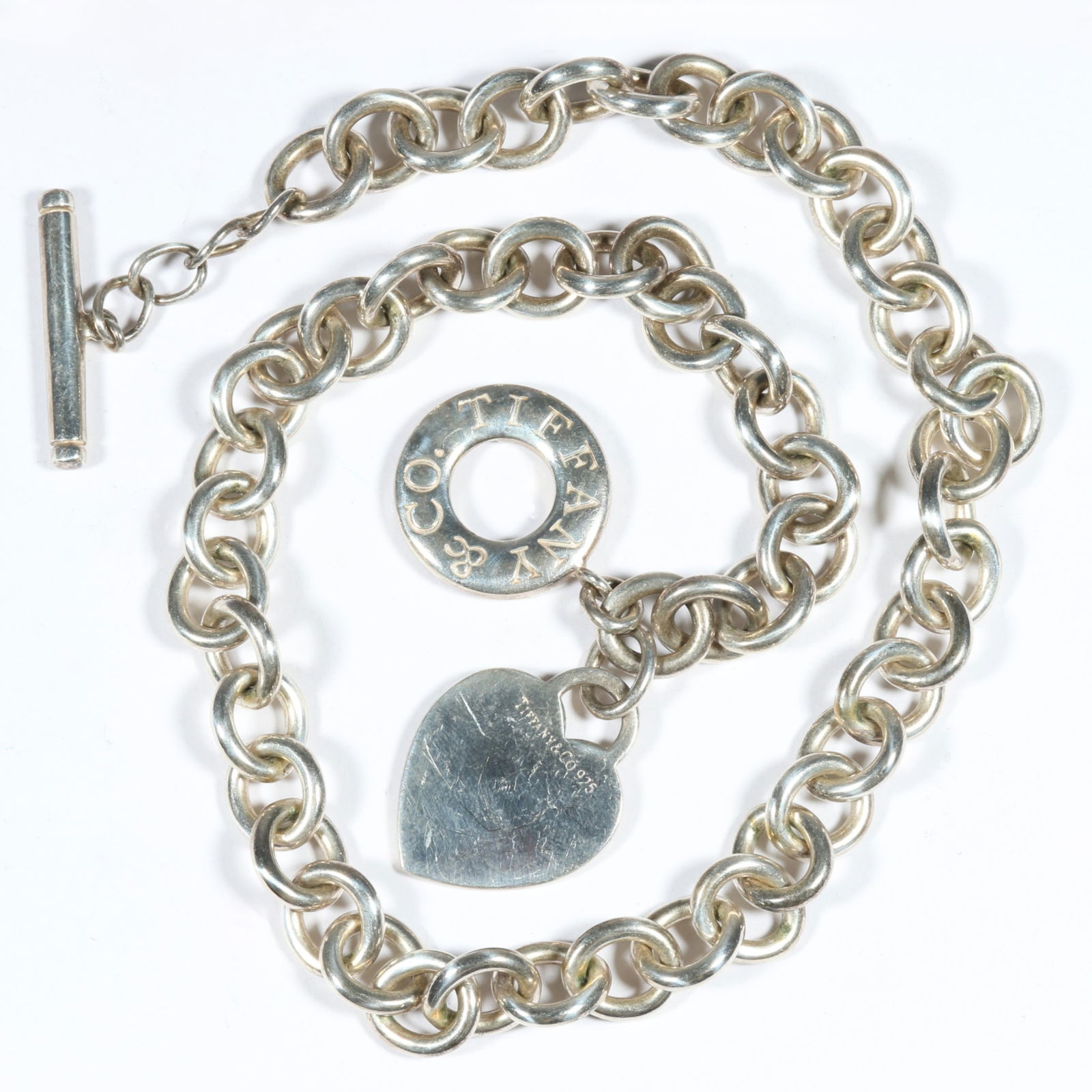 Tiffany & Co. sterling silver chain link choker necklace with heart charm and original dust bag. 15: Tiffany & Co. sterling silver chain link choker necklace with heart charm and original dust bag. 68.3g 15 1/2"L x 1 1/2"Drop