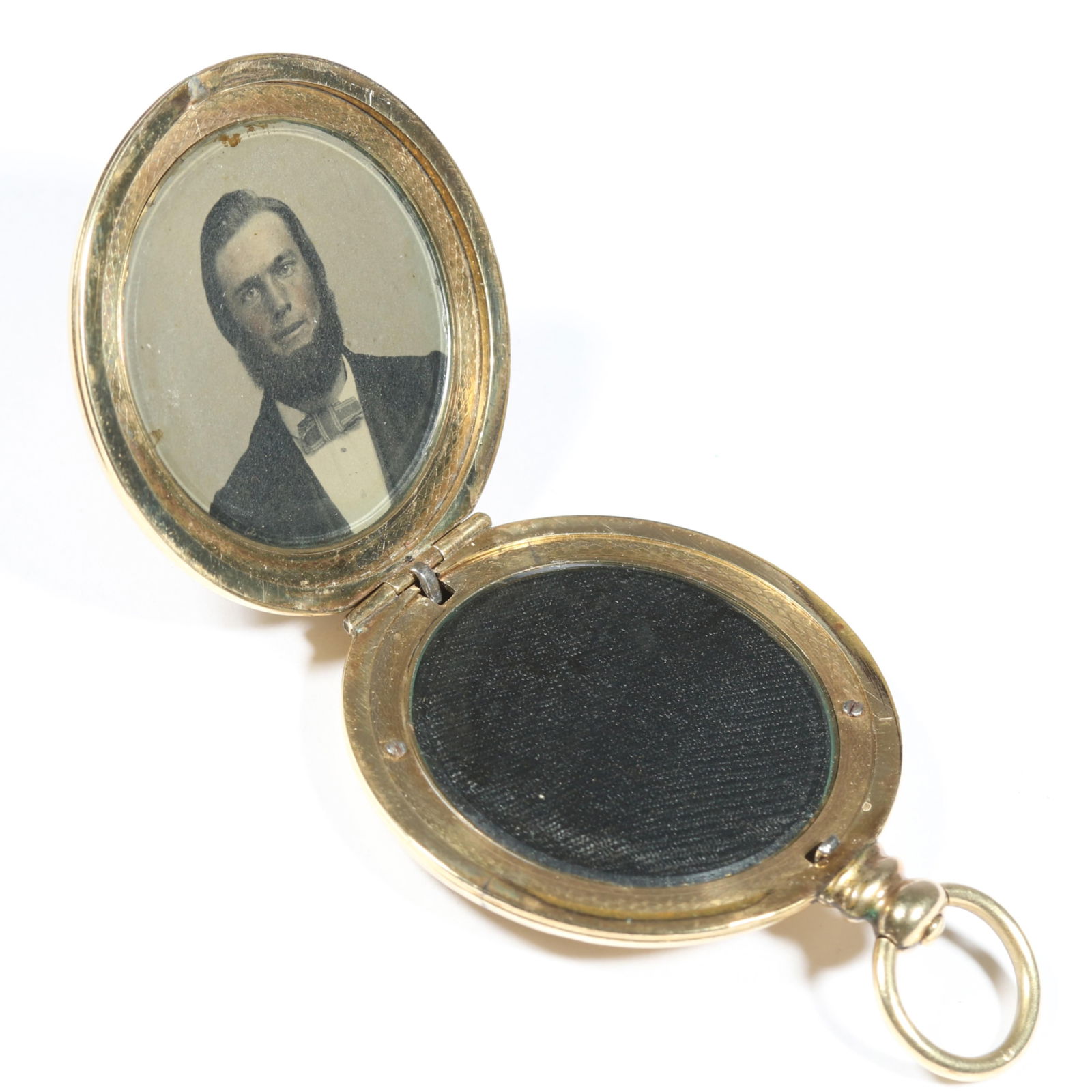 Victorian gold filled engraved locket with hand tinted photo of a man and fabric in the other panel. (1 of 5)
