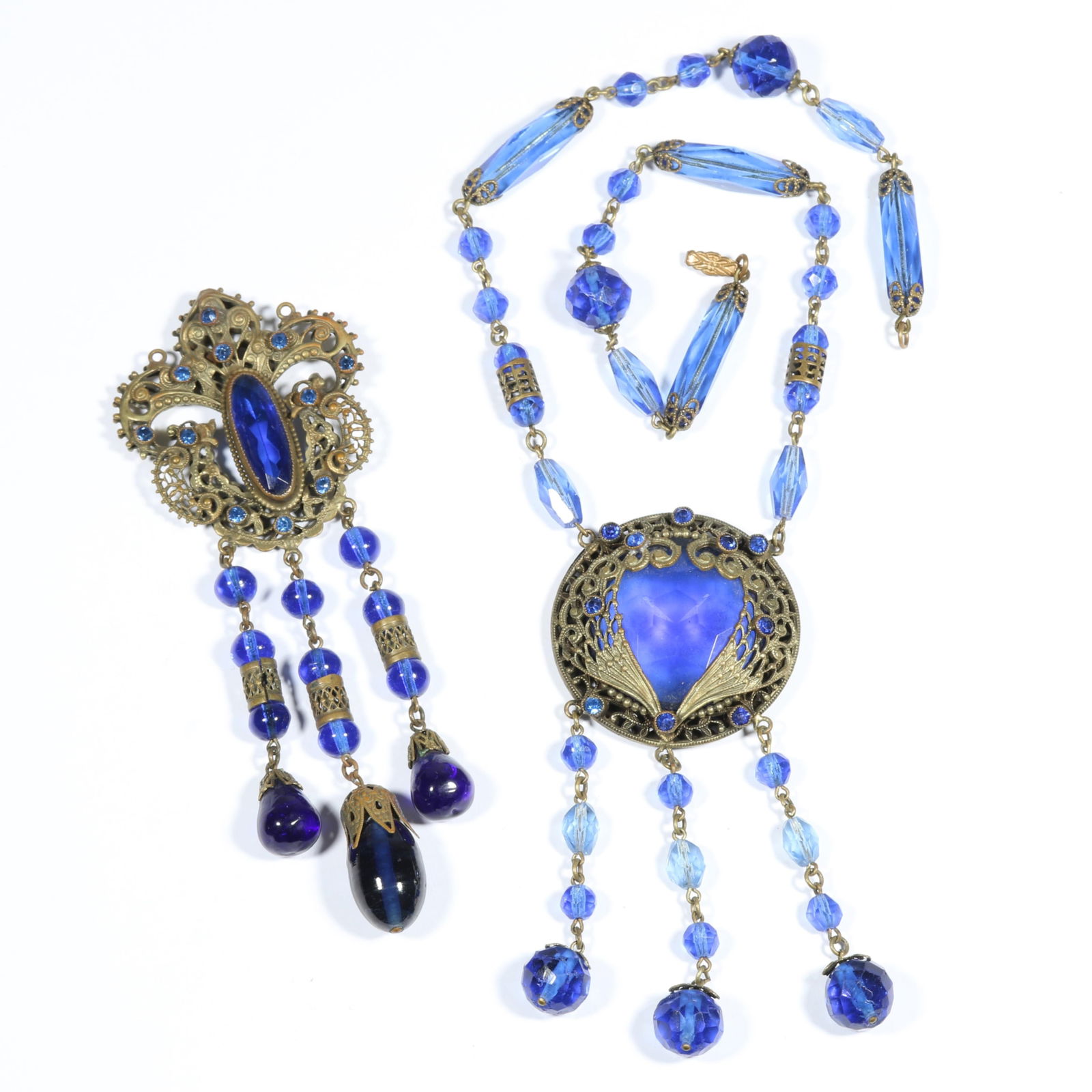 Antique cobalt blue Czech glass filigree drop necklace with drop pendant. 17 3/8"L x 4"Drop: Antique cobalt blue Czech glass filigree drop necklace with drop pendant. Some wear to glass crystals. 17 3/8"L x 4"Drop (necklace)