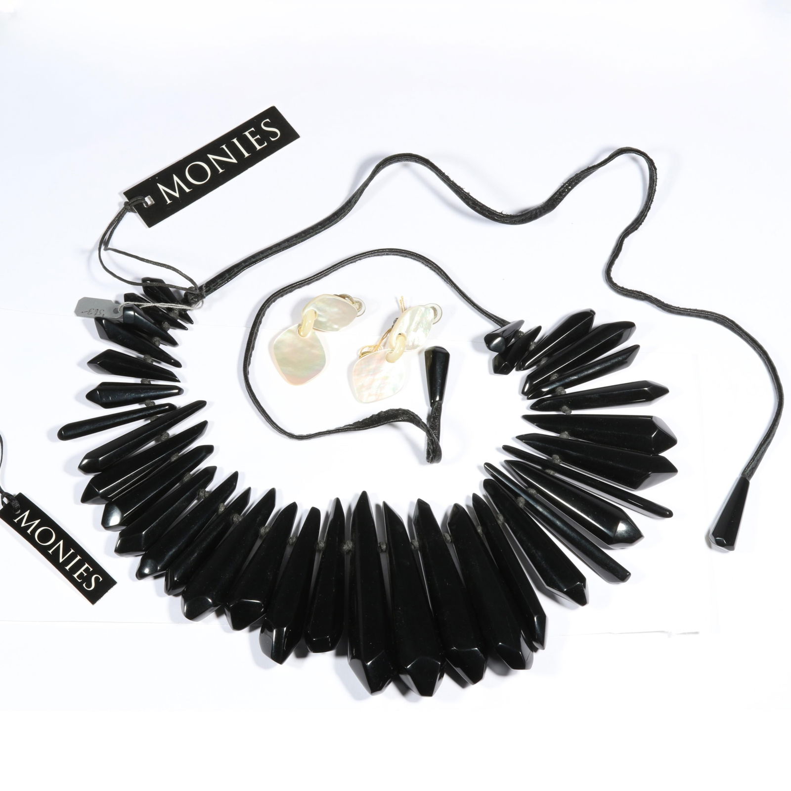 Signed MONIES black resin necklace and MOP earrings with original tags 2 1/4"L x 3/4"W: Signed MONIES black resin necklace and MOP earrings with original tags From the life time collection of Donna Soodalter-Toman, DIVA owner/founder and winner of Best of Boston for DIVA's prominent role