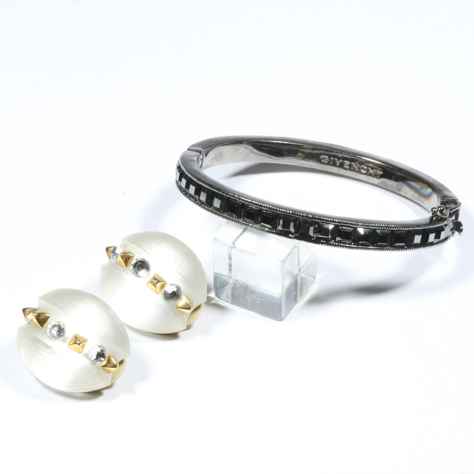 Givenchy channel set hematite gunmetal bracelet with Alexis Bittar mirrored studded Lucite earrings.: Givenchy channel set hematite gunmetal bracelet with Alexis Bittar mirrored studded Lucite earrings. 1/4"H x 2 1/4"Inner Diameter (bracelet)