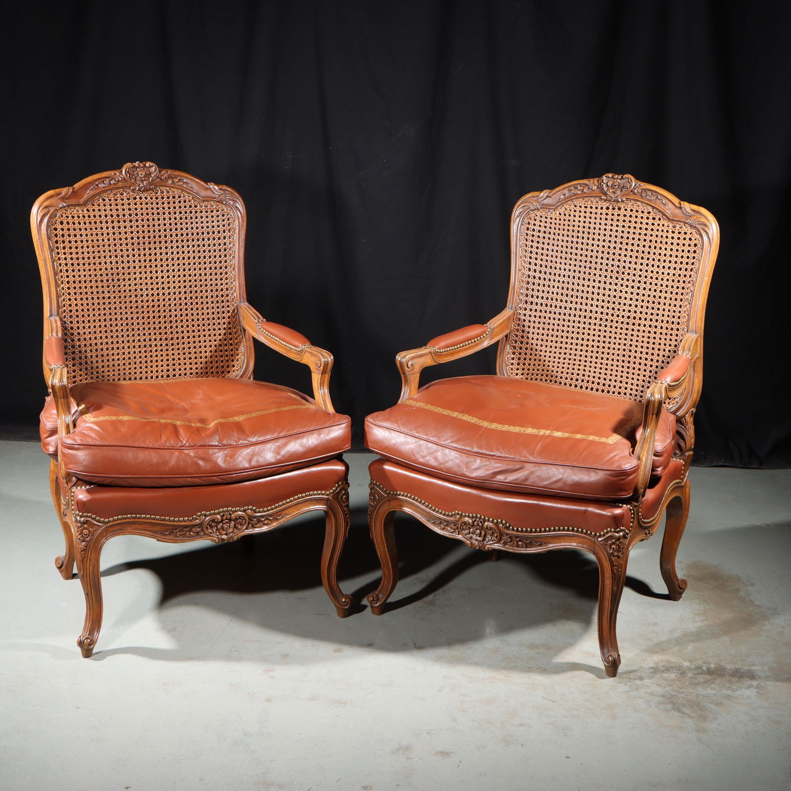 Pair French Louis XV style carved fauteuils with cane backs and leather cushions, 41 1/2"H x 29"W (1 of 16)