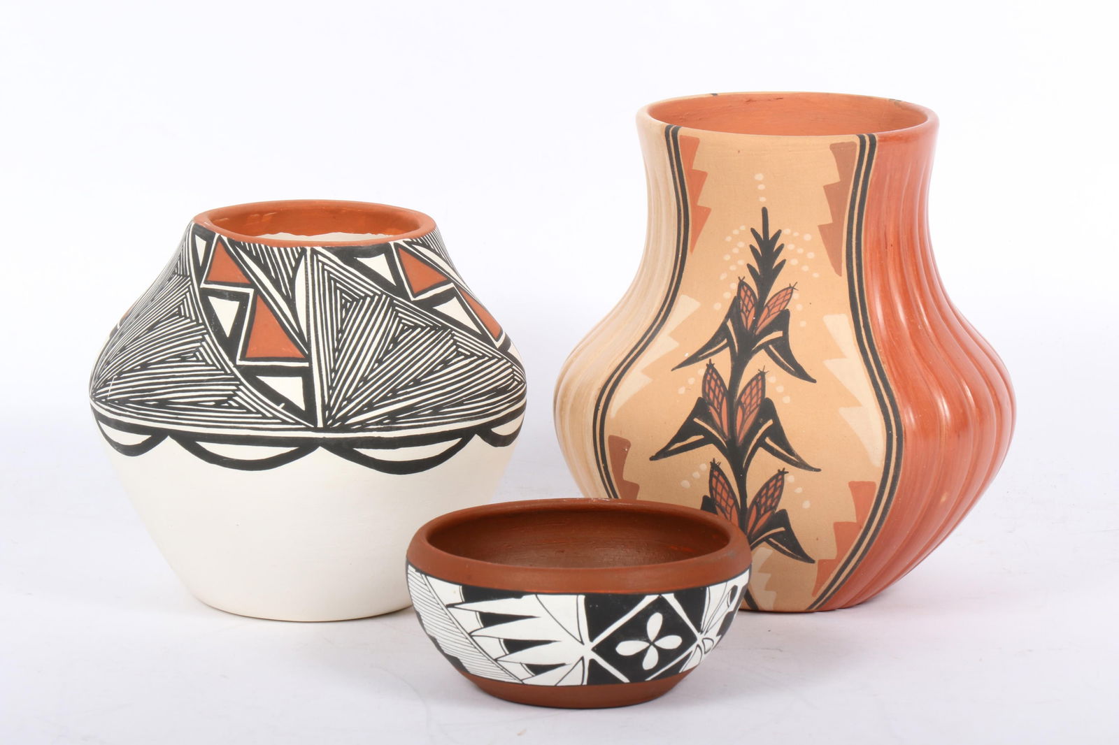 Three Native American Pueblo polychrome pottery vessels: Acoma Pueblo pottery olla signed with (1 of 14)