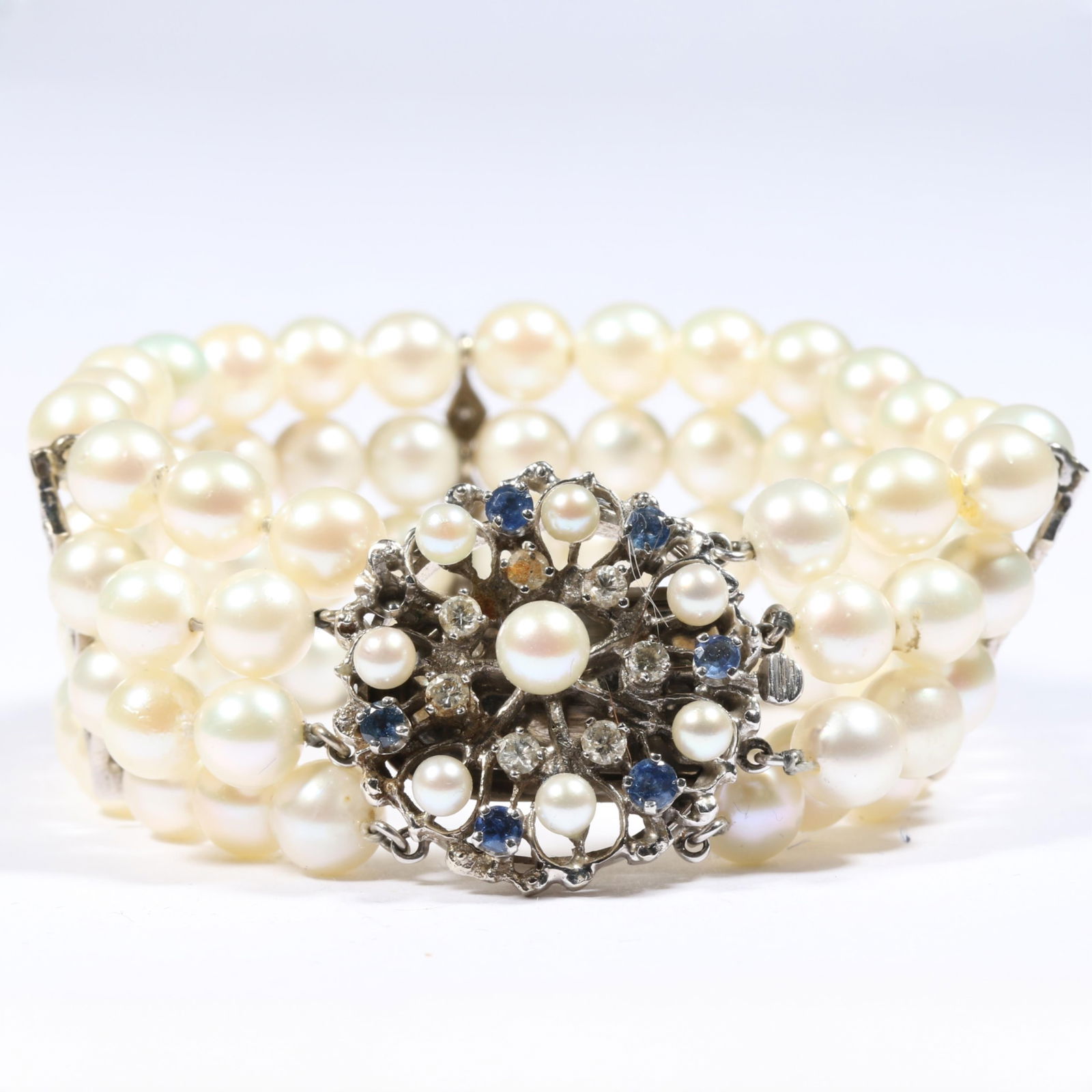 14K white gold and cultured pearl bracelet with diamond and sapphire clasp and diamond spacers. 6 (1 of 11)