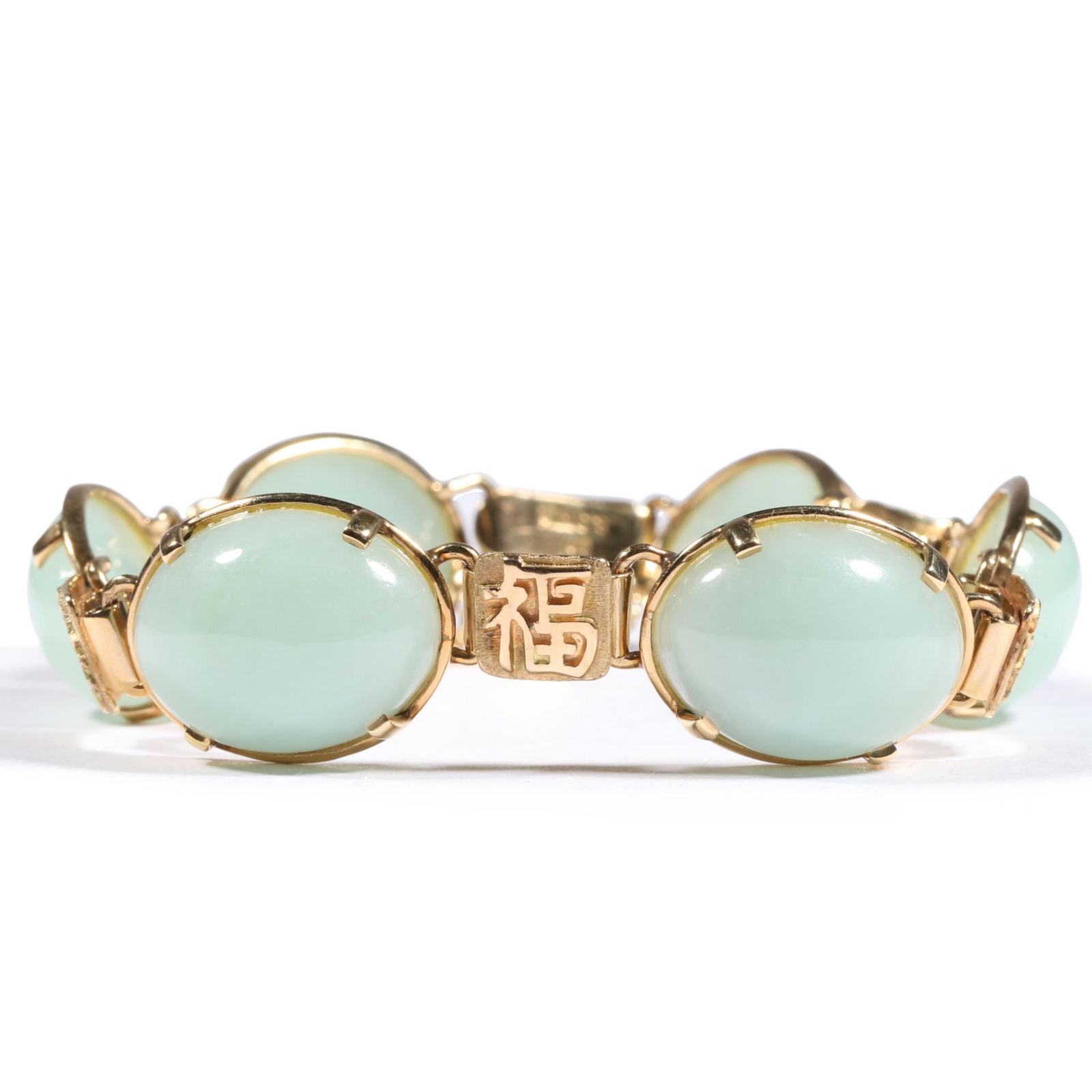 14K yellow gold Ming's jade cabochon bracelet with Chinese character spacers. 6 3/4"L x 5/8"W: 14K yellow gold Ming's jade cabochon bracelet with Chinese character spacers. 20.083DWT The purchase of gold requires confirmed funds. 6 3/4"L x 5/8"W