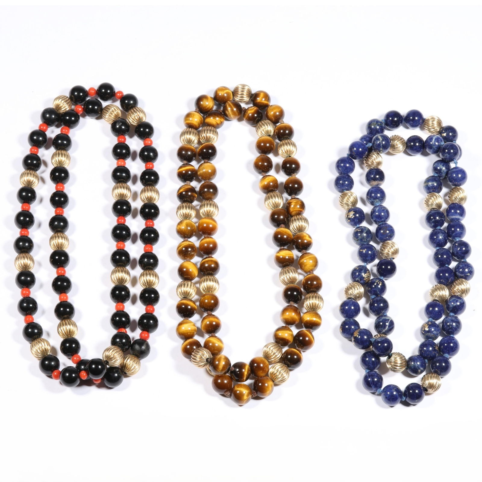 14K yellow gold beads on sodalite, tigers eye, and onyx and coral necklaces. 26"Long (all): 14K yellow gold beads on sodalite, tigers eye, and onyx and coral necklaces. Blue stones have painted on gold flecks 234.6g (total) 10mm beads (all) The purchase of gold requires confirmed funds. 26"L