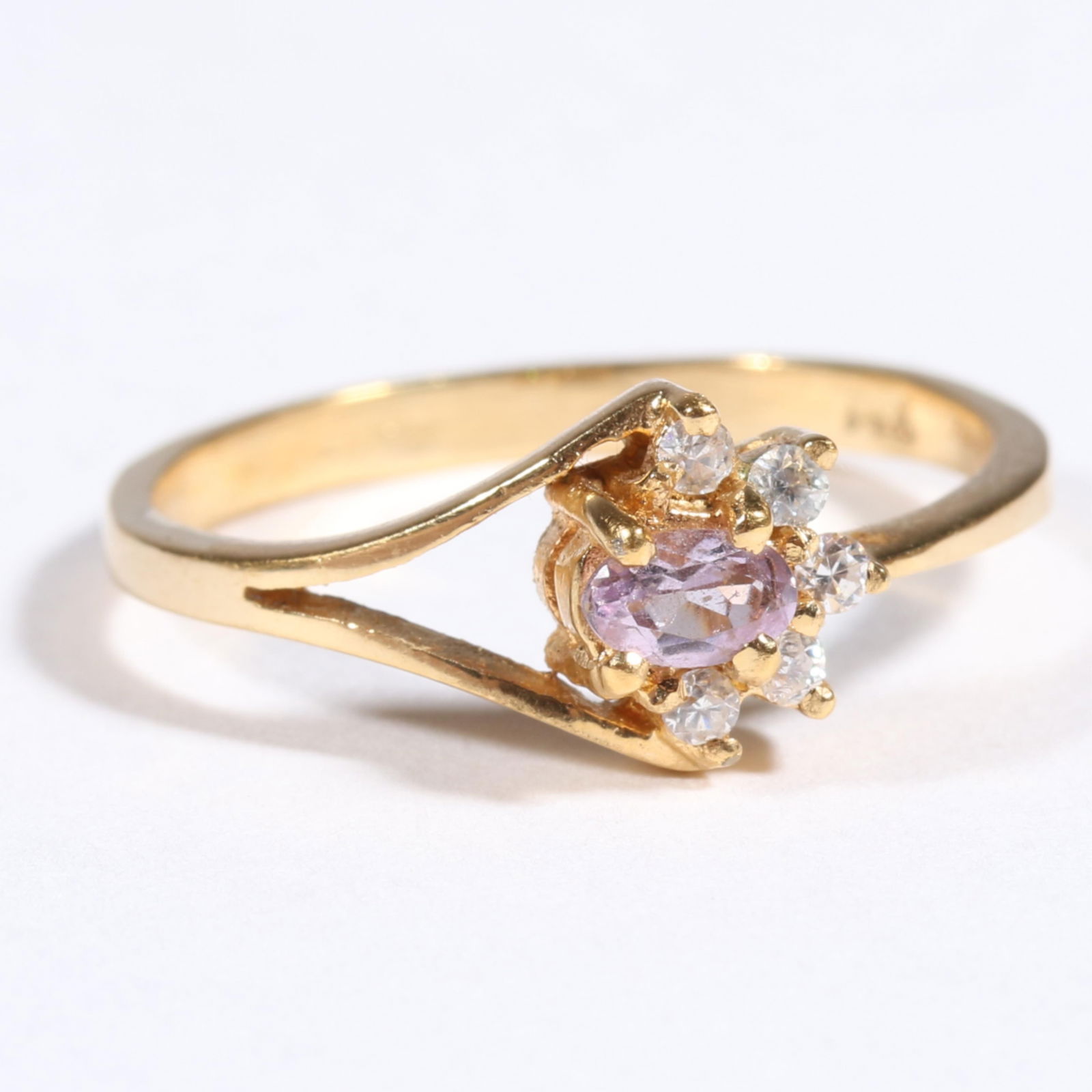 14K yellow gold ring with amethyst? rose quartz? and diamond accents. Ring size 9 1/2: 14K yellow gold ring with amethyst? rose quartz? and diamond accents. 1.45 DWT The purchase of gold requires confirmed funds. Ring size 9 1/2