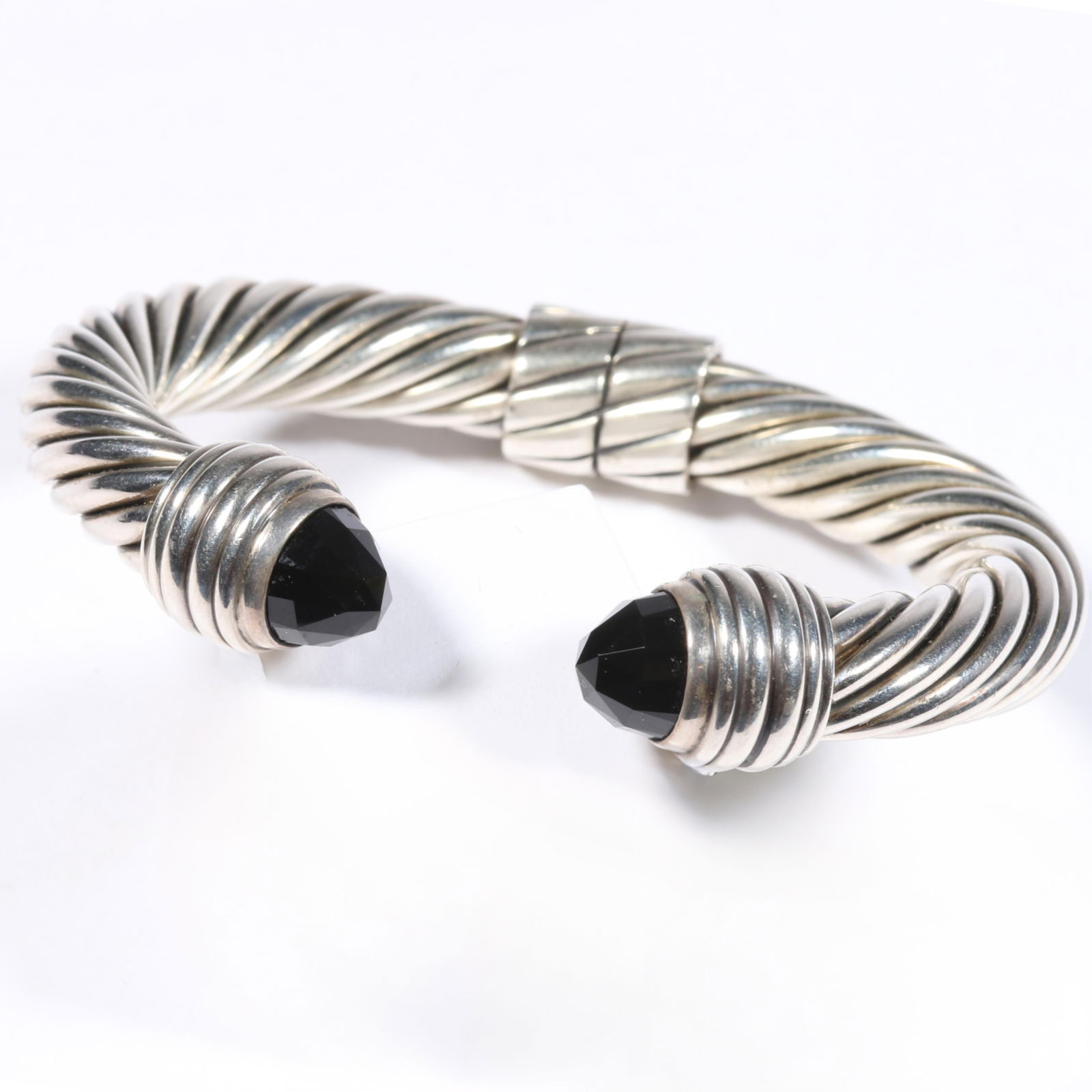 David Yurman sterling silver faceted onyx hinged cable cuff bracelet. 5 1/2"inside circumference x: David Yurman sterling silver faceted onyx hinged cable cuff bracelet. 51.2g 5 1/2"inside circumference x 1/2"gap