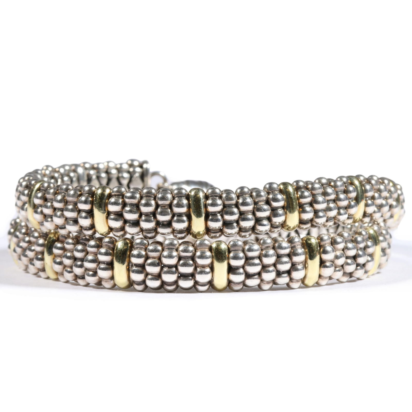 LAGOS pair of sterling silver & 18K gold caviar bracelets with replaced magnetic clasps, unmarked. 7: LAGOS pair of sterling silver & 18K gold caviar bracelets with replaced magnetic clasps, unmarked. 93.5g (together) 7 1/4"L x 3/8"W (both)