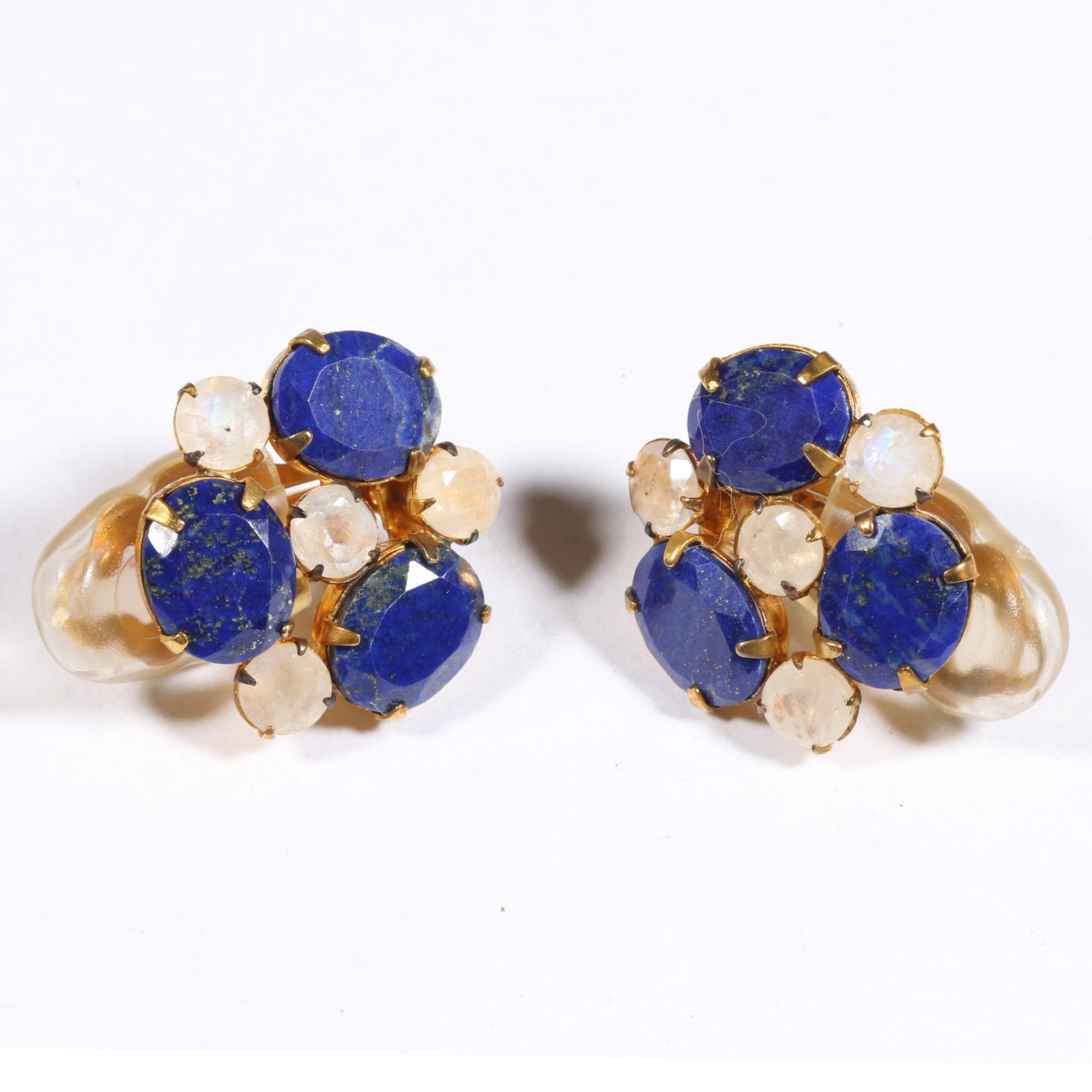 Hassan Bounkit lapis lazuli and moonstone gold plated clip earrings. 7/8"L x 7/8"W: Hassan Bounkit lapis lazuli and moonstone gold plated clip earrings. From the life time collection of Donna Soodalter-Toman, DIVA owner/founder and winner of Best of Boston for DIVA's prominent role i