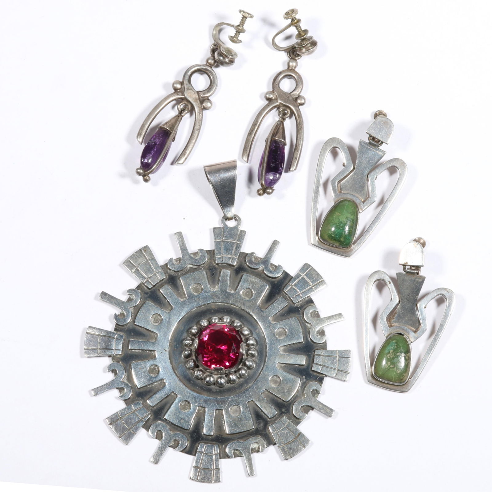 Vintage Mexican sterling jewelry group including HUGE medallion pink stone pendant, sterling Cortes: Vintage Mexican sterling jewelry group including HUGE medallion pink stone pendant, sterling Cortes amethyst drop earrings, sterling green turquoise earrings. 92.3 grams total From the life time colle