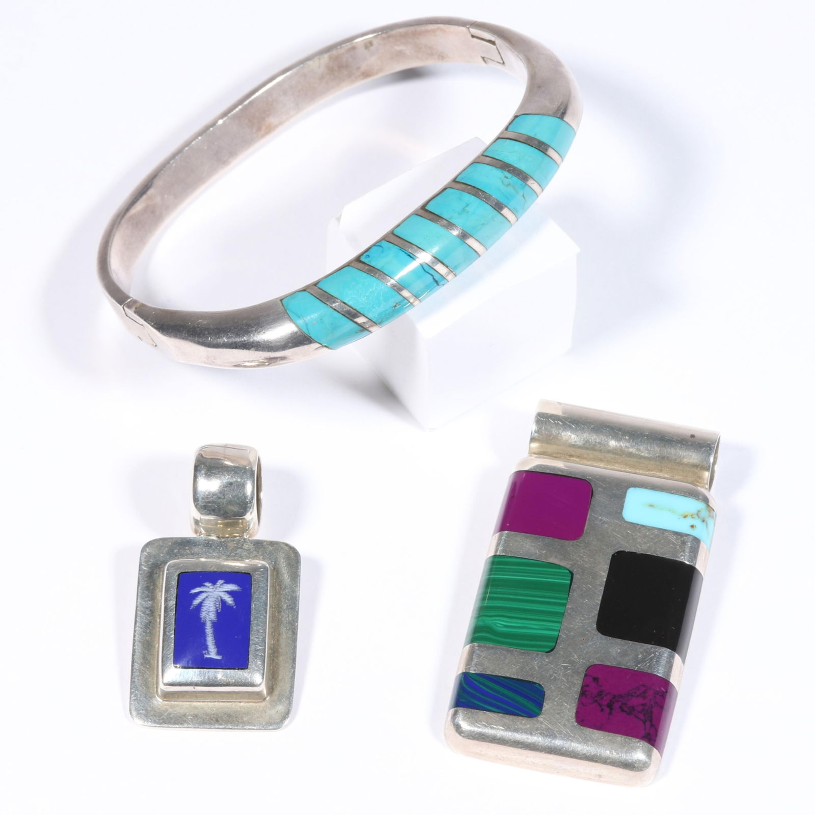Mexican sterling silver group including Taxco turquoise bracelet, Talleres Lagunas natural stone: Mexican sterling silver group including Taxco turquoise bracelet, Talleres Lagunas natural stone inlay pendant, and lapis palm tree pendant. 89.1g (all together) From the life time collection of Donna