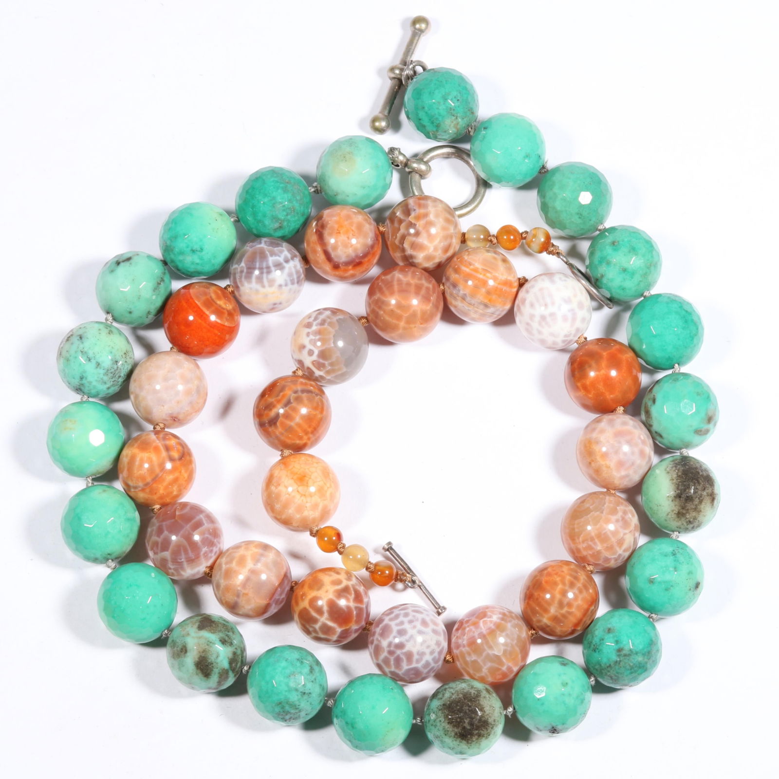 Artisan DVA made chrysoprase and fire opal agate beaded necklaces 19"L x 3/4"W (both): Artisan DVA made chrysoprase and fire opal agate beaded necklaces Fire agate necklace has sterling clasp. From the life time collection of Donna Soodalter-Toman, DIVA owner/founder and winner of Best