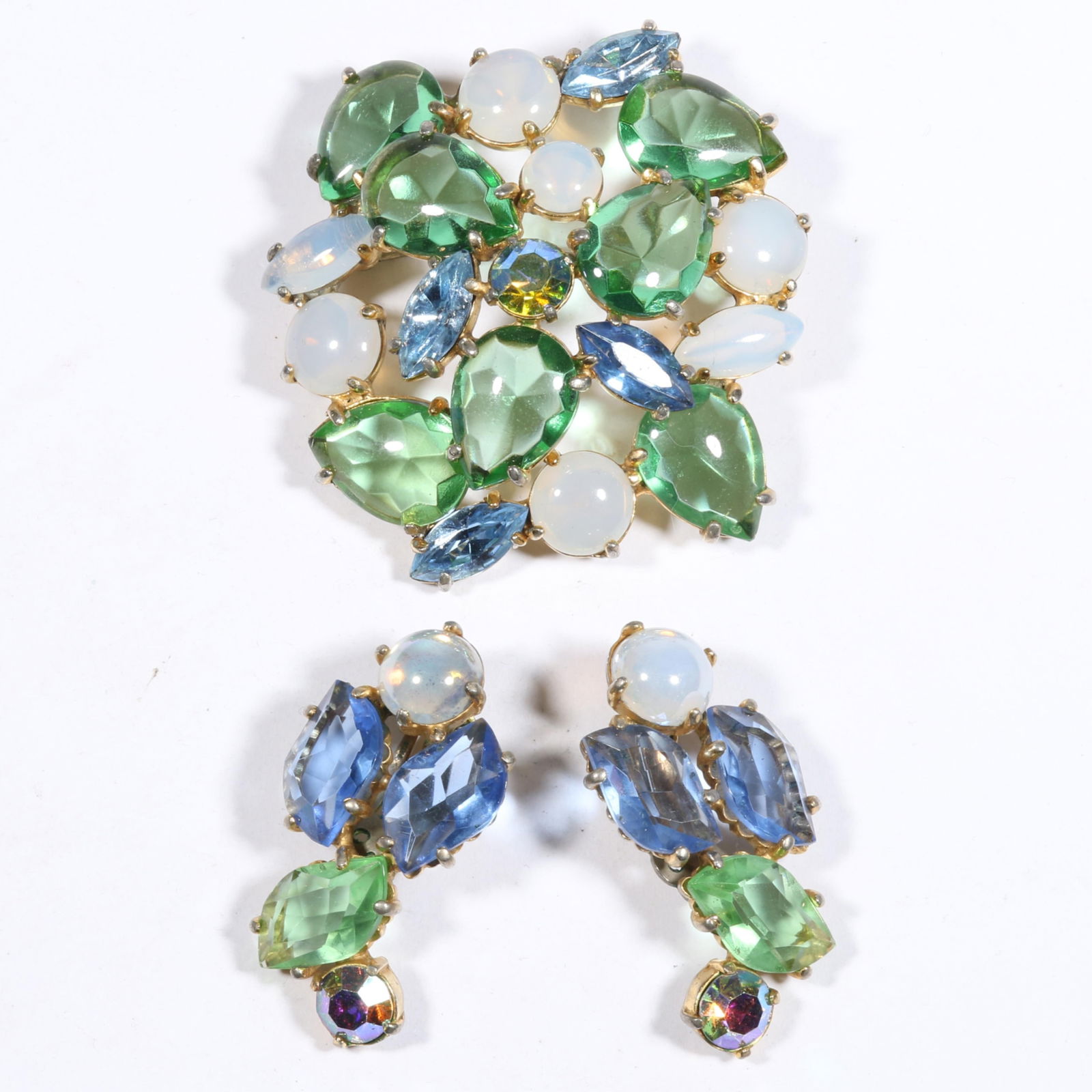 Schiaparelli springtime rhinestone crystal demi parure with brooch and earrings decorated with faux: Schiaparelli springtime rhinestone crystal demi parure with brooch and earrings decorated with faux opal glass stones. 2 1/2"Diameter (brooch)