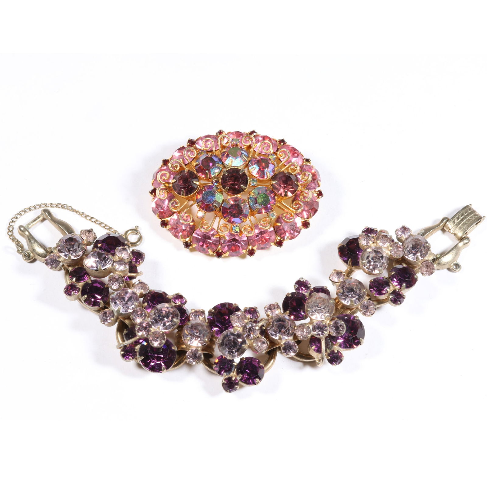 D & E Juliana rhinestone crystal bracelet and brooch. 7"L x 1"W (bracelet): D & E Juliana rhinestone crystal bracelet and brooch. Light wear to aurora borealis on brooch. 7"L x 1"W (bracelet)